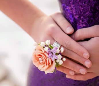 Pink Rose Ring Corsage - This unique rendition of a traditional corsage is perfect to impress your prom date. Light pink spray rose with babys breath, muted greens and rhinestone center. Customizable.