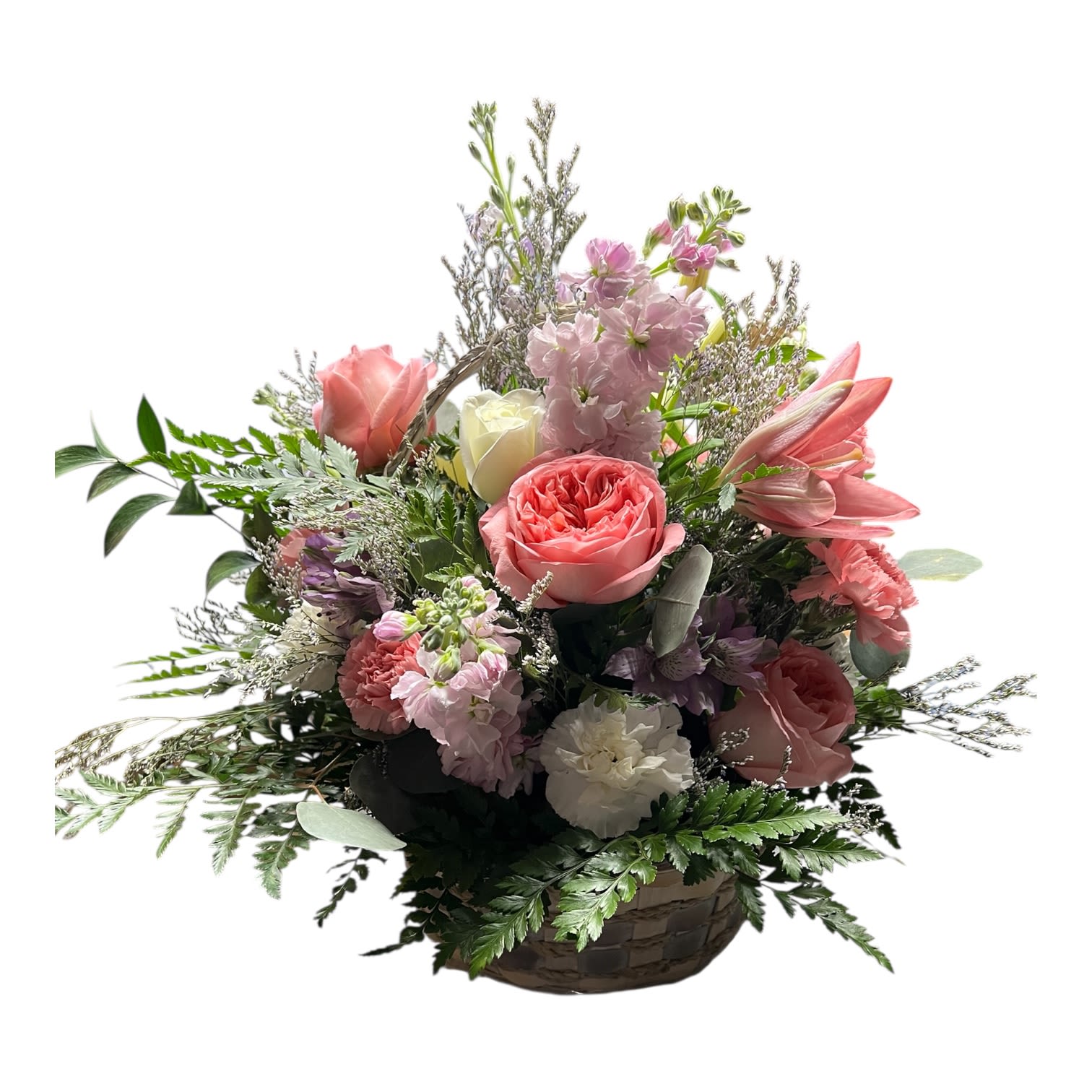 Basket of  pinks and purples - A beautiful  7" basket of pink and purple flowers.  Garden roses, spray roses, stock, Gerber daisy and assorted greenery. 