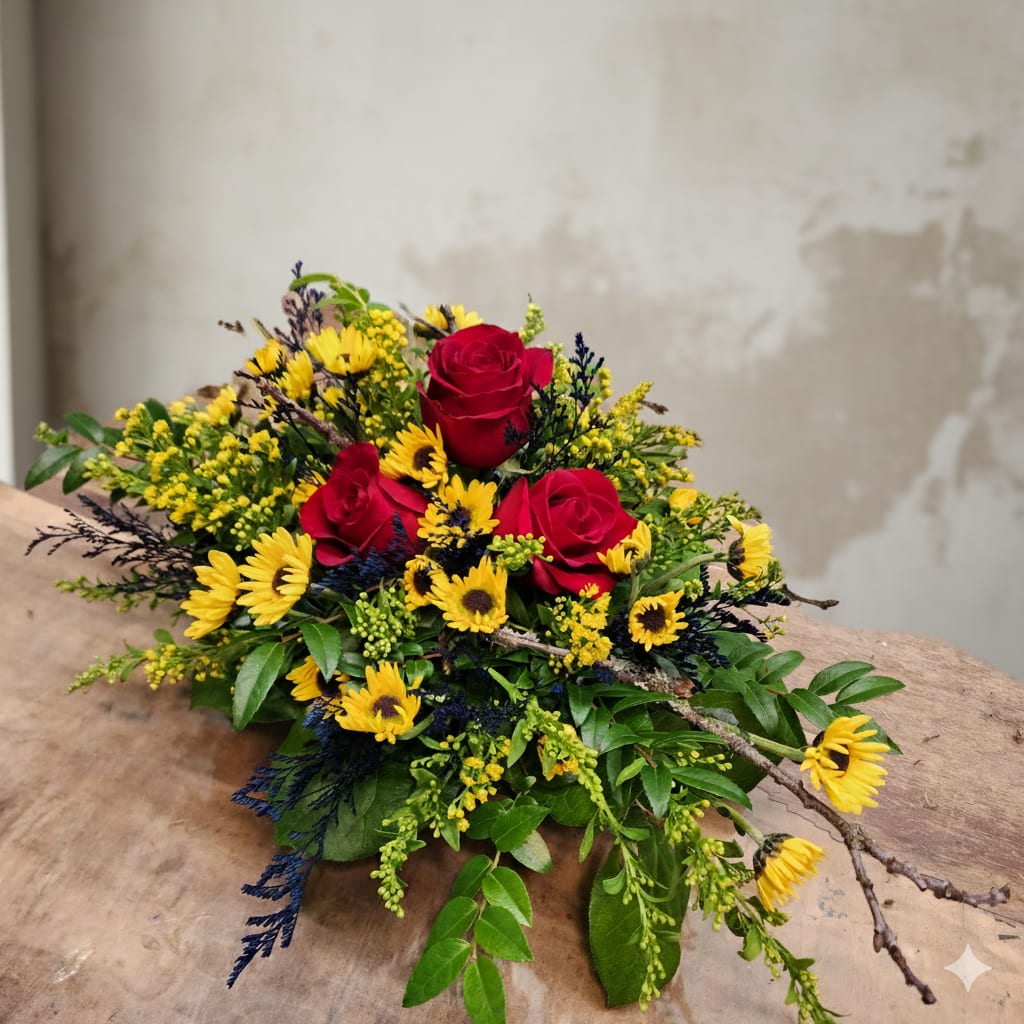 Country Style Roses - "Welcome to our Olympia, WA flower shop, where we take pride in creating unique and stunning floral arrangements. Our latest creation features a captivating blend of yellow daisies, delicate blue misty, and velvety red roses, making it the perfect choice for both celebrating a country girl's birthday and extending a heartfelt apology.  What sets this arrangement apart is not just its vibrant color palette but also the infusion of the Pacific Northwest's natural beauty. We've meticulously gathered fresh Pacific Northwest moss, handpicked from the lush landscapes of our region, and placed it meticulously within this country girl bouquet.  With our commitment to quality and customer satisfaction, we offer same-day flower delivery services in Olympia and the surrounding areas. Whether you're celebrating a birthdays or expressing your deepest regrets, you can count on us to deliver your heartfelt message with the freshest and most beautiful flowers.  Our same-day flower delivery service ensures that your thoughtful gesture arrives right on time, making those meaningful moments even more special. Olympia's charm and beauty inspire our creations, and we're excited to share the essence of the Pacific Northwest with you through our handcrafted bouquets.   