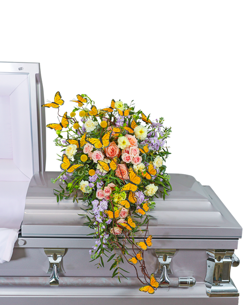 Wind Beneath My Wings Casket Spray - Our Wind Beneath My Wings Casket Scarf is a vibrant casket spray adorned with a delicate design of pinks, yellows, purples, and fluttering butterflies, symbolizing a graceful farewell. The harmonious blend of colors and elegant butterflies creates a serene and beautiful tribute, honoring the memory of a loved one with both warmth and serenity.
