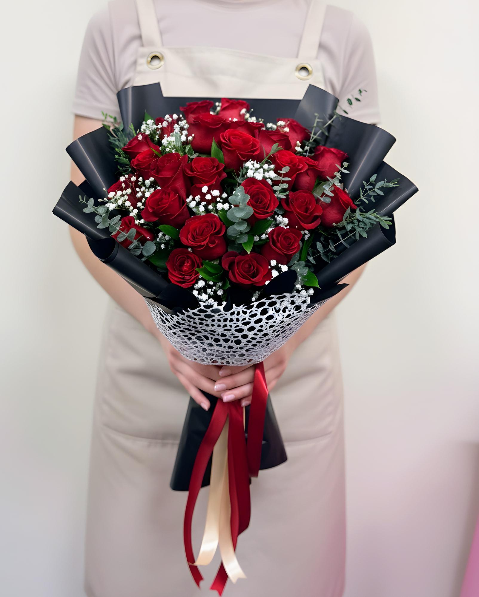 Forever Yours Bouquet - A luxurious bouquet of premium red roses beautifully arranged with lush greenery and elegantly wrapped for a sophisticated presentation. The deep crimson roses symbolize love, passion, and admiration, making this bouquet a perfect expression of romance and heartfelt emotion. Handcrafted with care, this stunning arrangement creates a timeless and unforgettable gift for someone special.