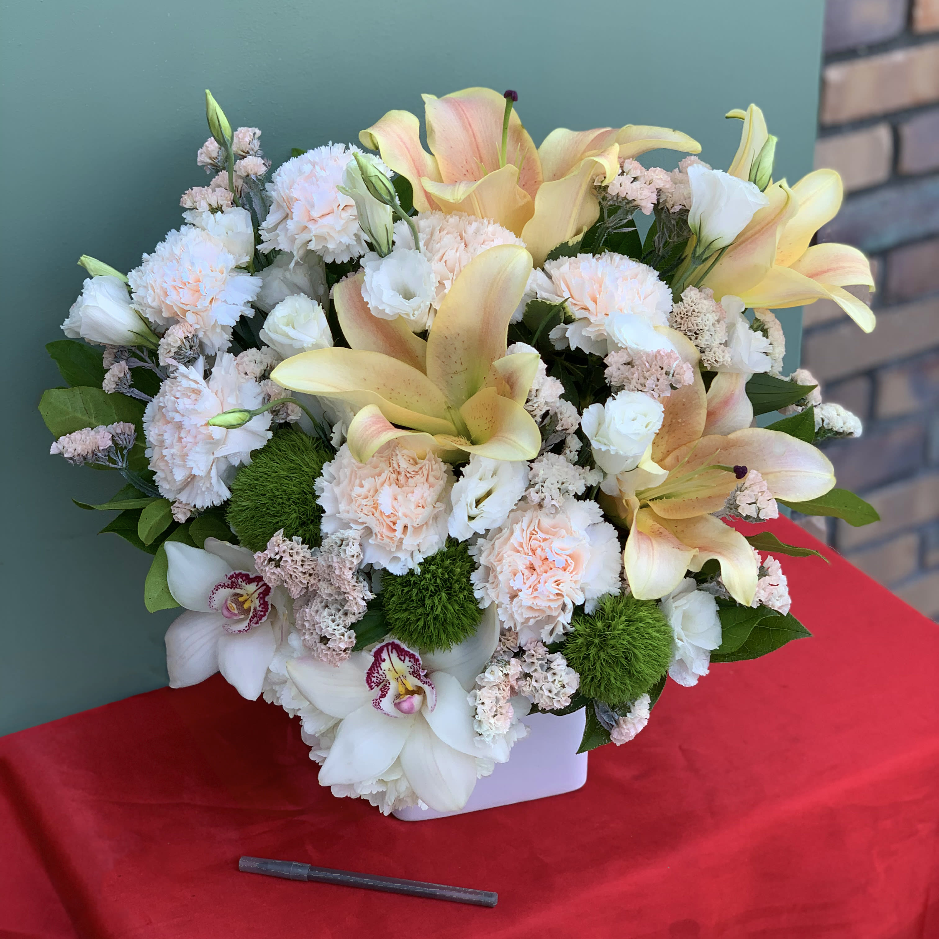 Come Find Me - Come Find Me! Said this light and delicate arrangement designed with orchids, lilies, carnation, lisianthus, and hydrangea. 