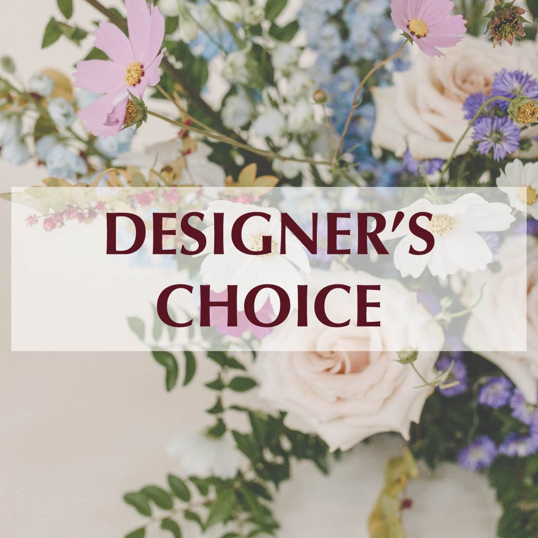 Designer’s Choice - Are you ready to experience the beauty and wonder of the season? Let our expert designers create a stunning floral arrangement for you, filled with the freshest and most vibrant blooms available. With a keen eye for detail and an unwavering commitment to quality, our designers will craft a unique and beautiful arrangement that perfectly captures the essence of the season.  While we cannot guarantee a specific flower type, we can guarantee that your arrangement will be beautiful, fresh, and filled with all the beauty and charm of the season. Our designers will carefully select each flower to ensure that your arrangement is truly one-of-a-kind and perfectly suited to your individual tastes and preferences.  So why wait? Let us create a stunning seasonal arrangement for you today and experience the beauty and wonder of the season in a whole new way. Whether you're looking to surprise someone special or simply want to treat yourself to a touch of natural beauty and tranquility, our seasonal arrangements are the perfect choice.