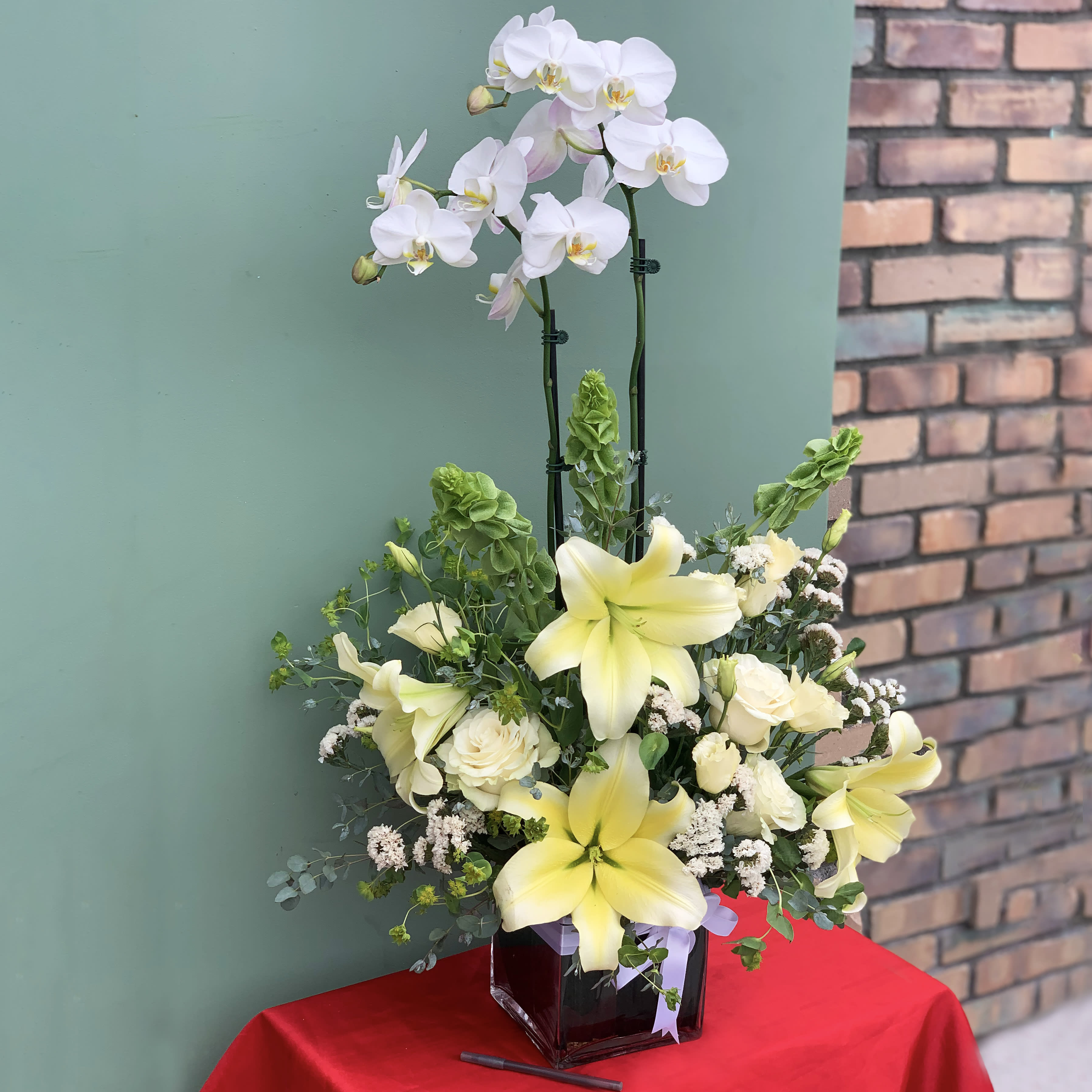 Dancing Friends - The best of both worlds, a living orchids and beautiful cut flowers designed to make a statement in any place