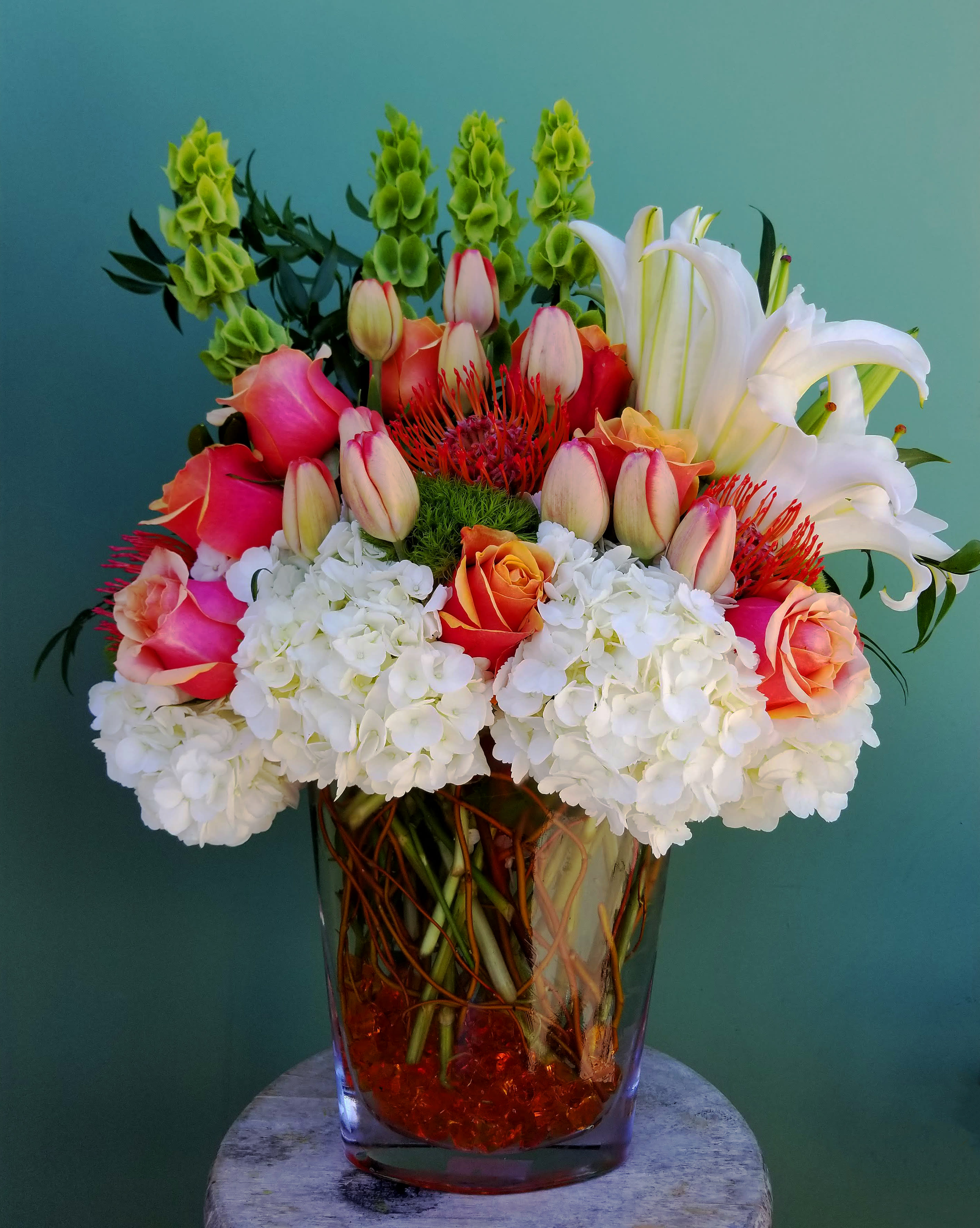 Dreamer's Blush - Beautiful melody of Roses, Tulips, Lilies, Hydrangea, Bells Of Ireland, Dianthus and greenary 