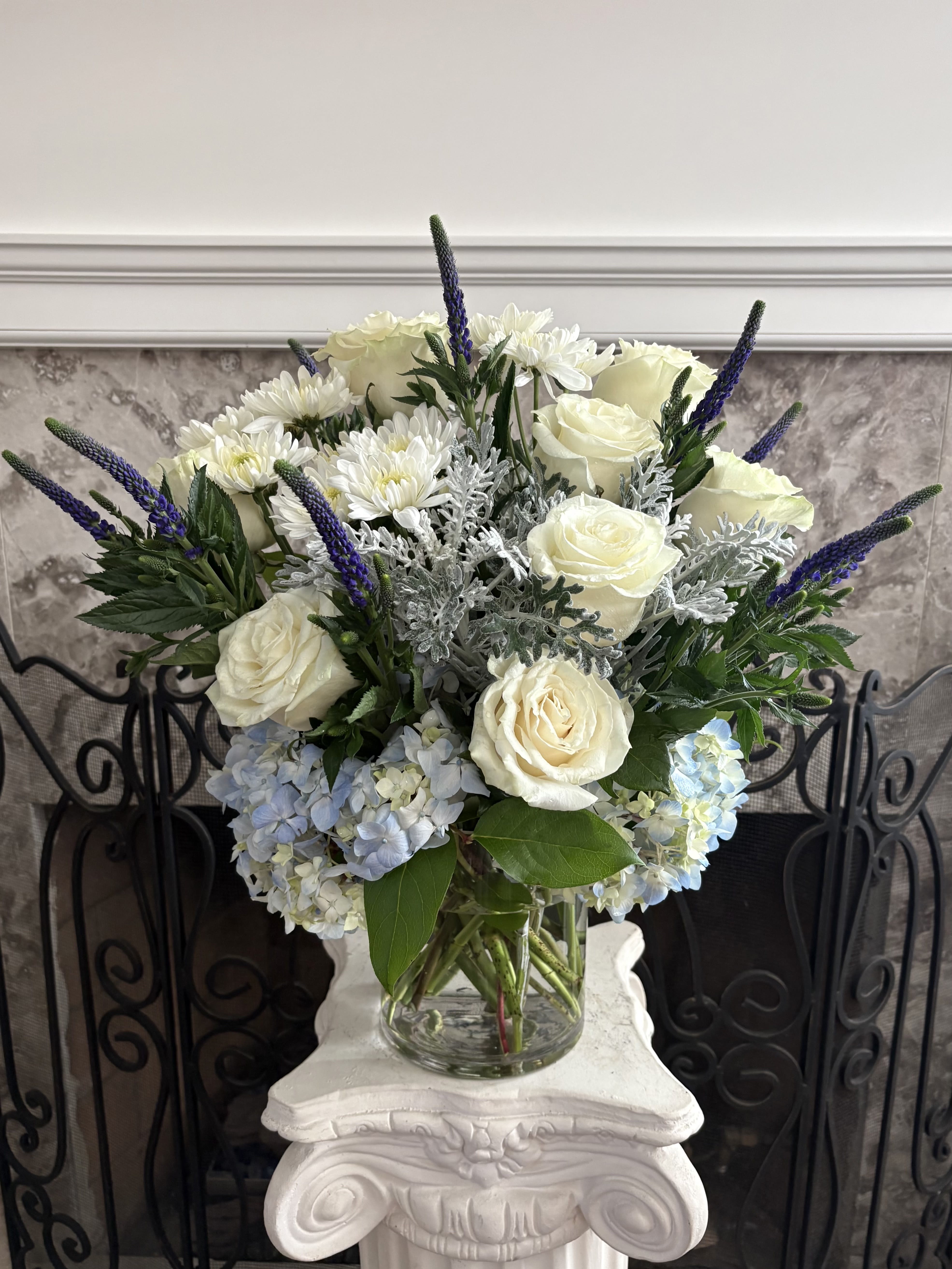 Clear Skies  Bouquet ( Exquisite Size) - Send a message of hope and positivity as clear and bright as a blue sky. This arrangement mixes a soft blend of white and blue blooms, creating a breath of fresh air for any occasion. 