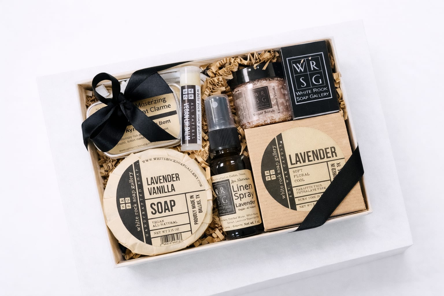 Lavender – Self-Care Gift Set - This Lavender gift set makes a perfect gift for anybody and for any occasion. Gift box comes complete with a bow to make gift giving easy.  Gift set contains: Lavender Vanilla Soap, Sisal Soap Pouch, Lavender Soy Wax Candle, Lavender Linen Spray, Lavender Vanilla Sugar Scrub Mini, Lavender Lotion Bar, Lip Balm, and a box of Matches