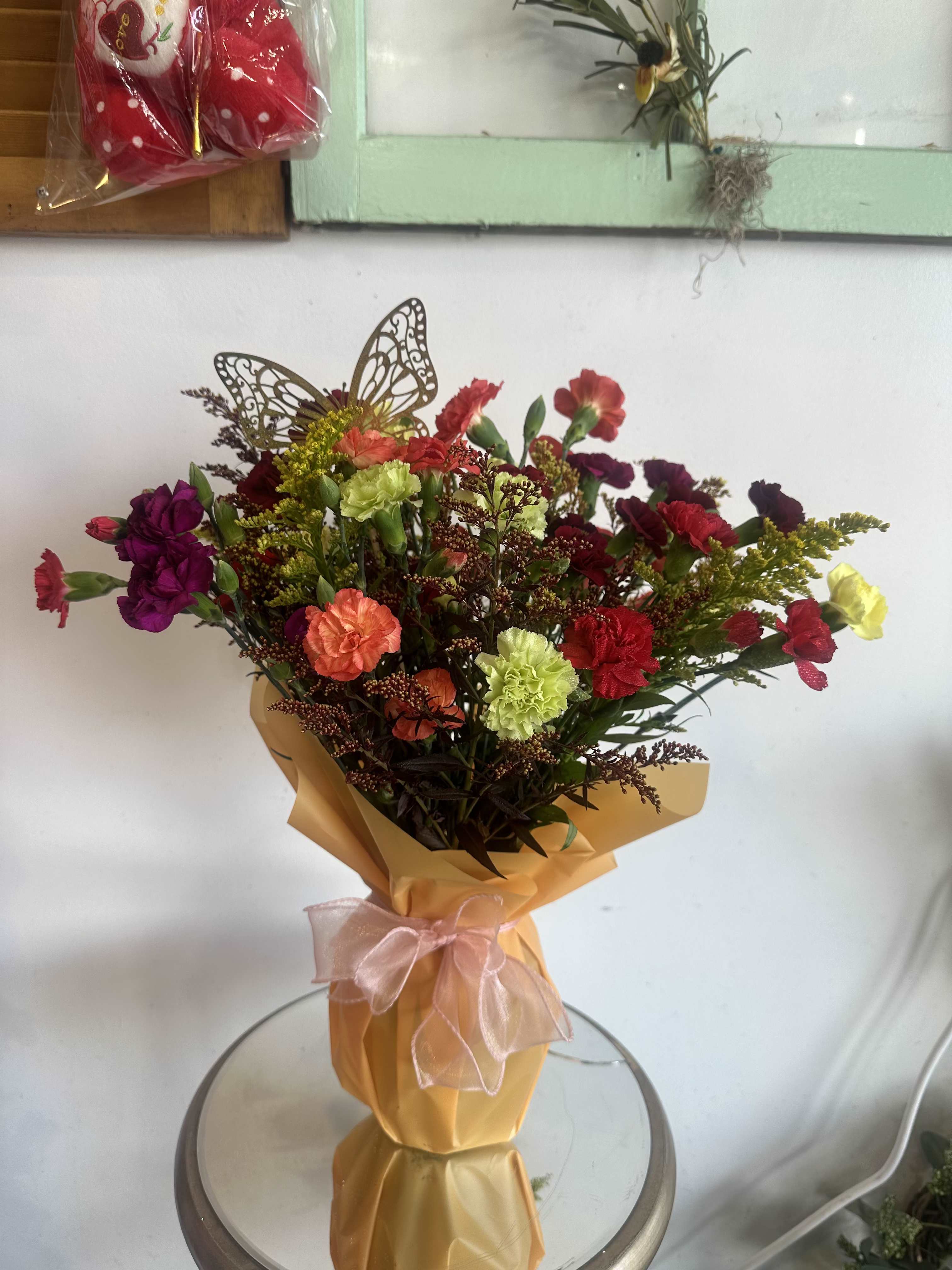 Carnation Special  - The Carnation Special features a delightful assortment of 15 mini mixed carnations, showcasing a vibrant palette that captures the essence of the current season. Each flower is carefully selected to ensure a harmonious blend of colors and textures, making it an ideal choice for various occasions.