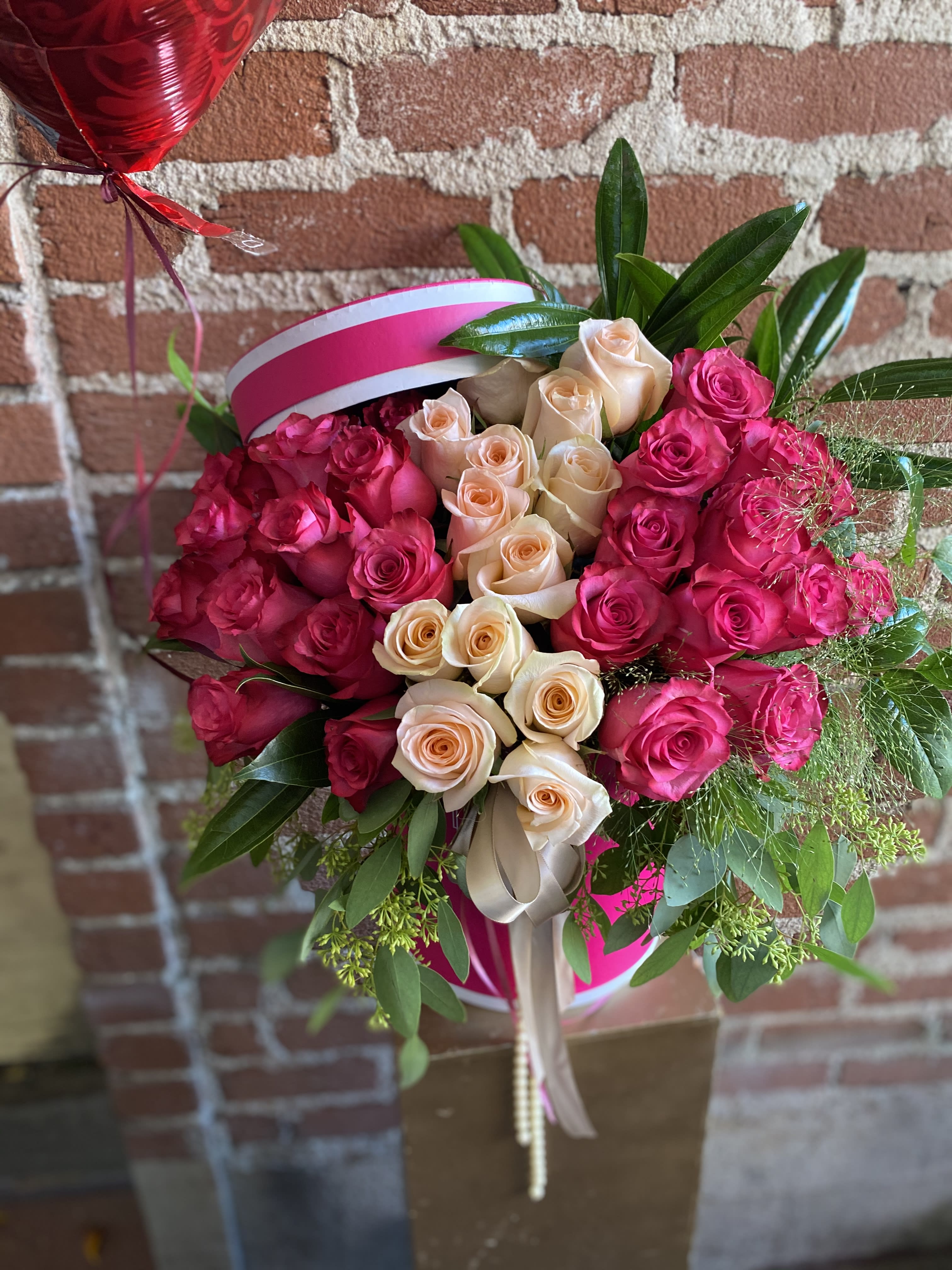 Pink Dreams -  Santa Clarita Valley Florist - This beautiful arrangement is designed to deliver happiness to a loved ones day. Filled with beautiful Pink and White Roses and customized to perfection, this arrangement is a showstopper! If you want to turn heads then this is the arrangement for you!