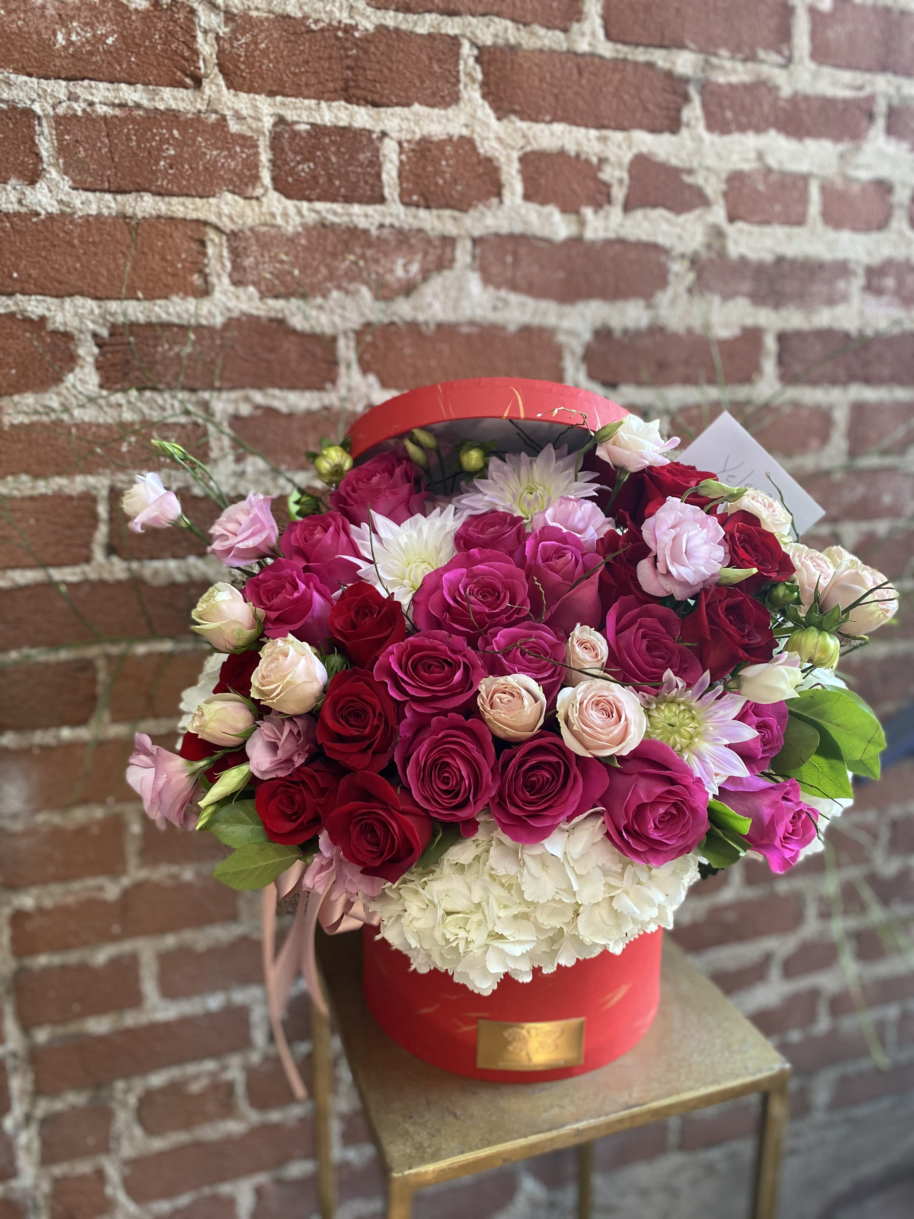 Red Bliss -  Santa Clarita Valley Florist - This beautiful arrangement is designed to deliver happiness to a loved ones day. Filled with beautiful flowers and customized to perfection, this arrangement is a showstopper!