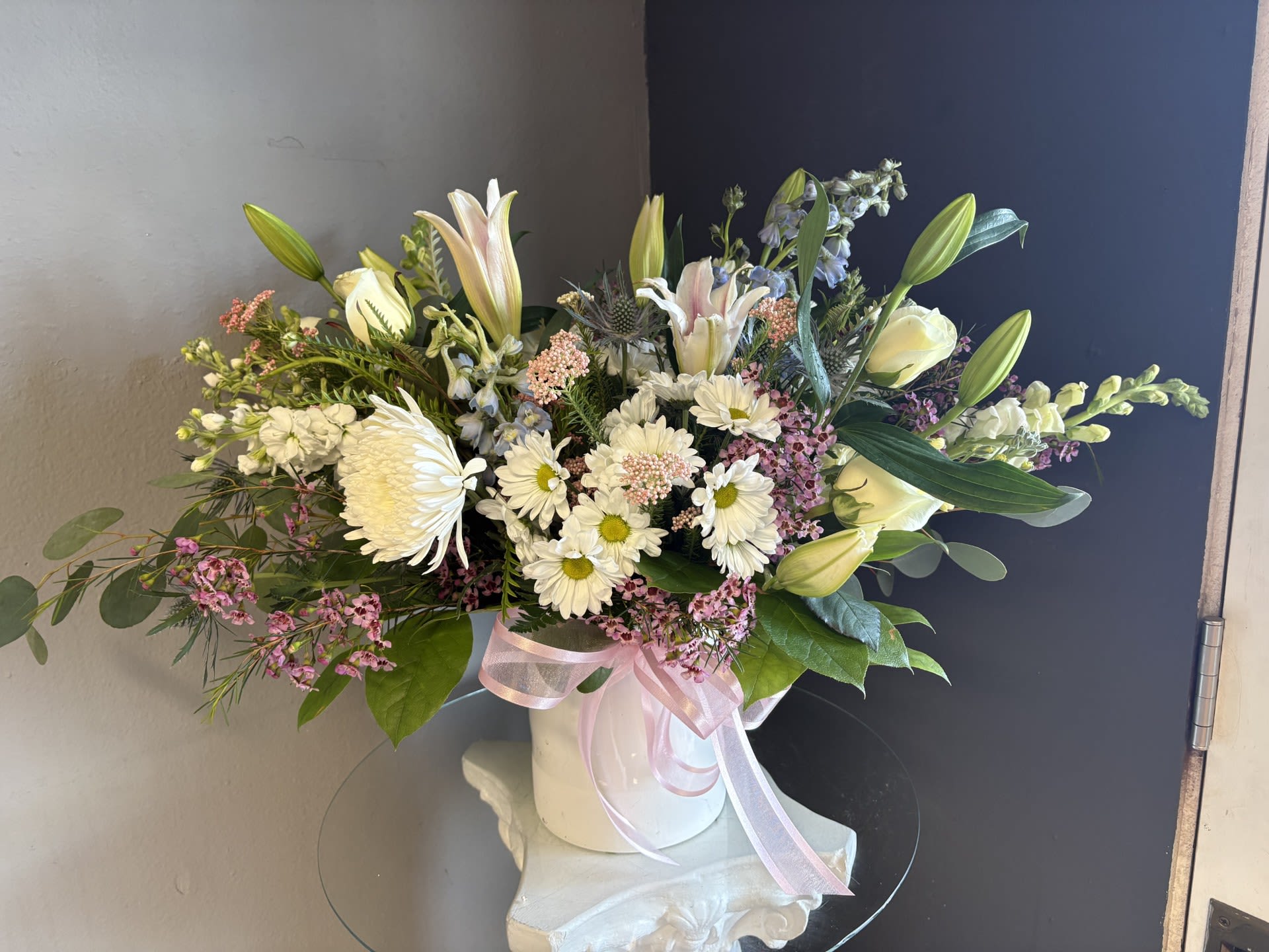 #739 Designer's Choice Vase Arrangement - This beautiful flower arrangement of fresh mixed seasonal blooms is made by local designers in the heart of Orange California. Hand crafted and perfect for every occasion, from birthdays and new babies to sympathy and just because. The best choice to show you are thinking of that special someone. Can be sent as a local delivery or in-store pickup. This is an original, one of a kind arrangement. Order now before it's too late!