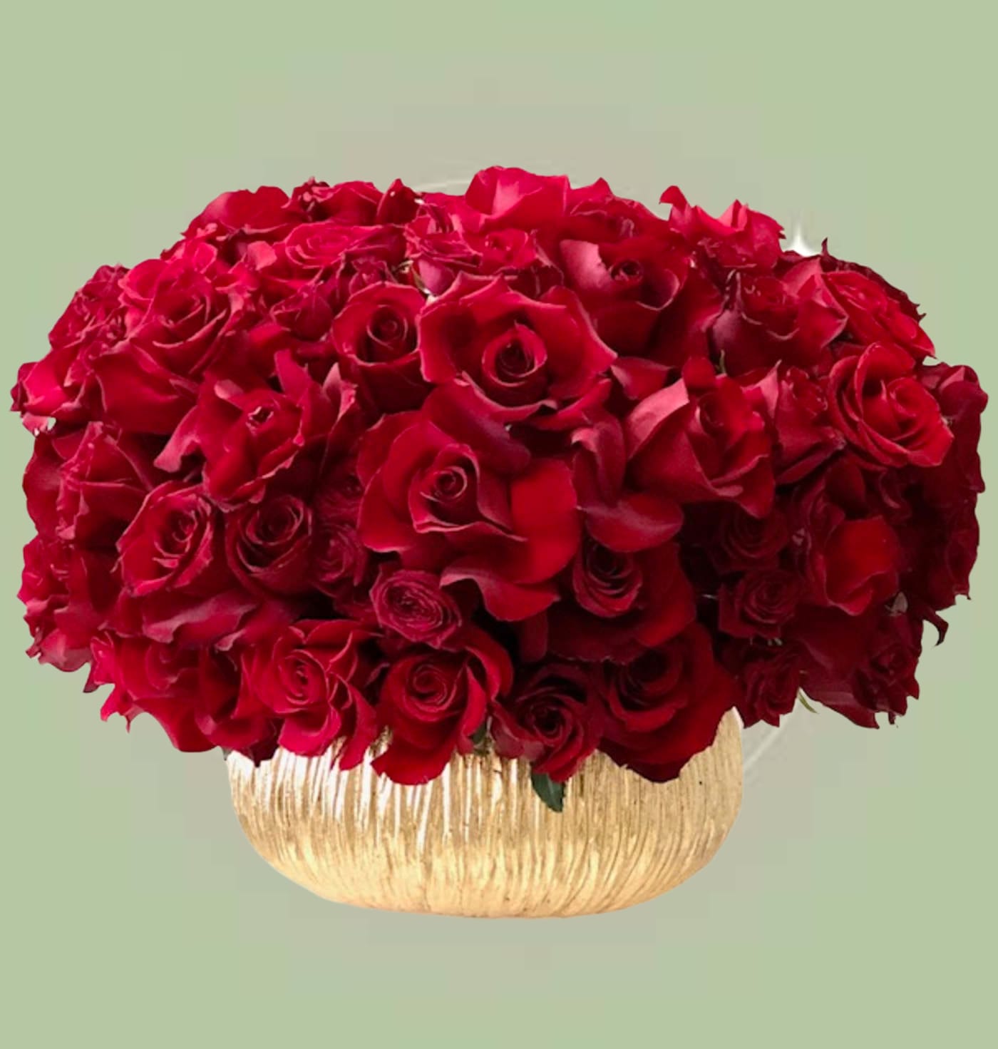Red Roses in Vase Arrangement  - Luxurious asymmetric lush composition features red blooms. Every petal is perfectly reflexed and ruffled by our master florist for bold elegance.  The Chic Red rests in a metallic gold vase for that couture statement.     Some florals are seasonal, if a particular flower will not be available due to season, we will substitute for similar flower, composition, color pallet and value of the arrangements as closely as possible. All effort to create a floral arrangement as close to the photo shown, the actual arrangement may vary slightly in its appearance from the photo shown. If you have any questions about your order, we welcome you to call us in or email    Holiday Delivery:  Same-day delivery available. Deliveries are made throughout the day based on routing.