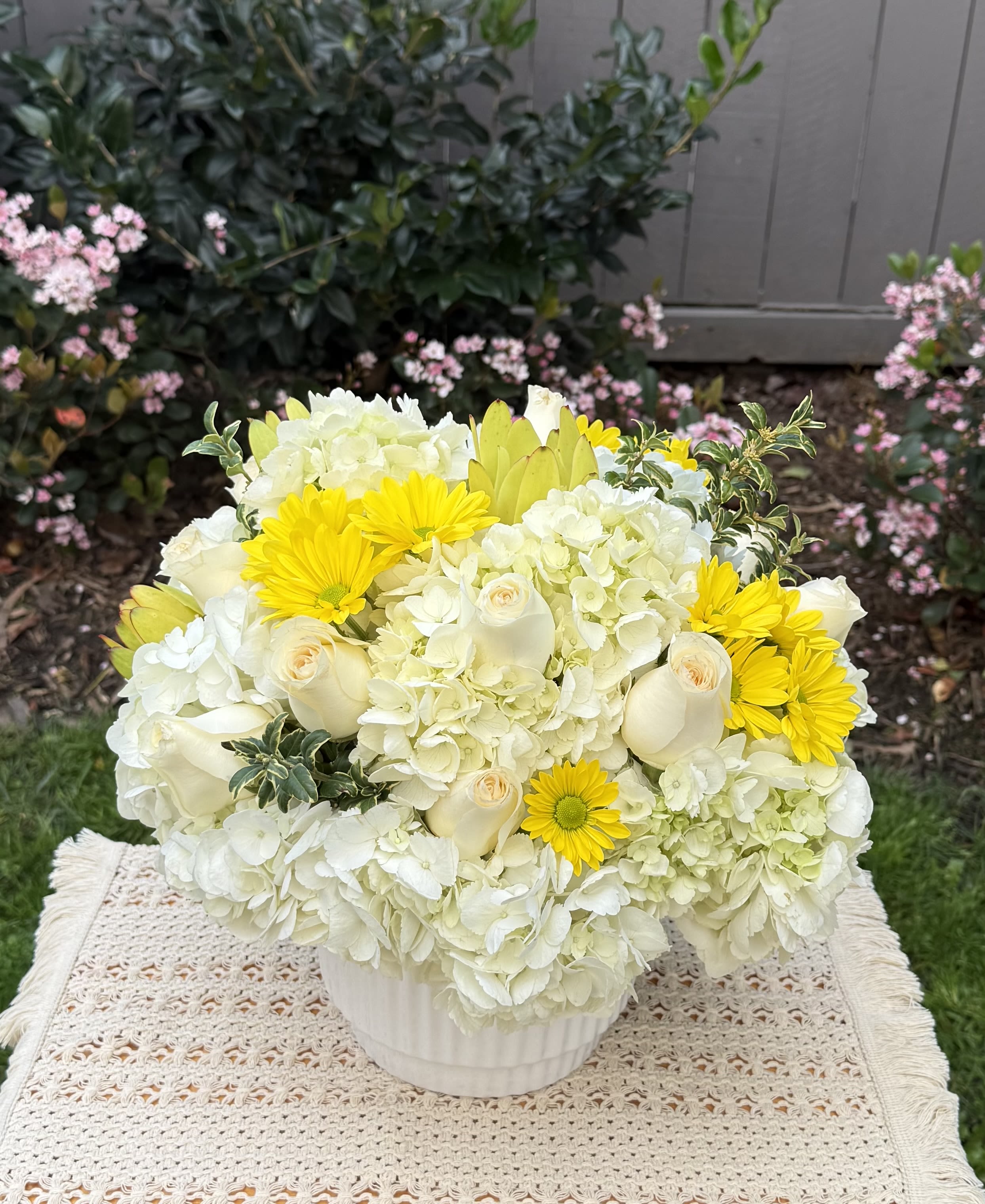 A Beautiful Sunny Day  - Beautiful sunny day, it is  the perfect name for this design crafted with premium white hydrangeas, Ecuadorian white  roses, fancy yellow daisies, and seasonal fresh foliage. It’s designed in a beautiful ceramic vase in white tones Medium size  Classic style  