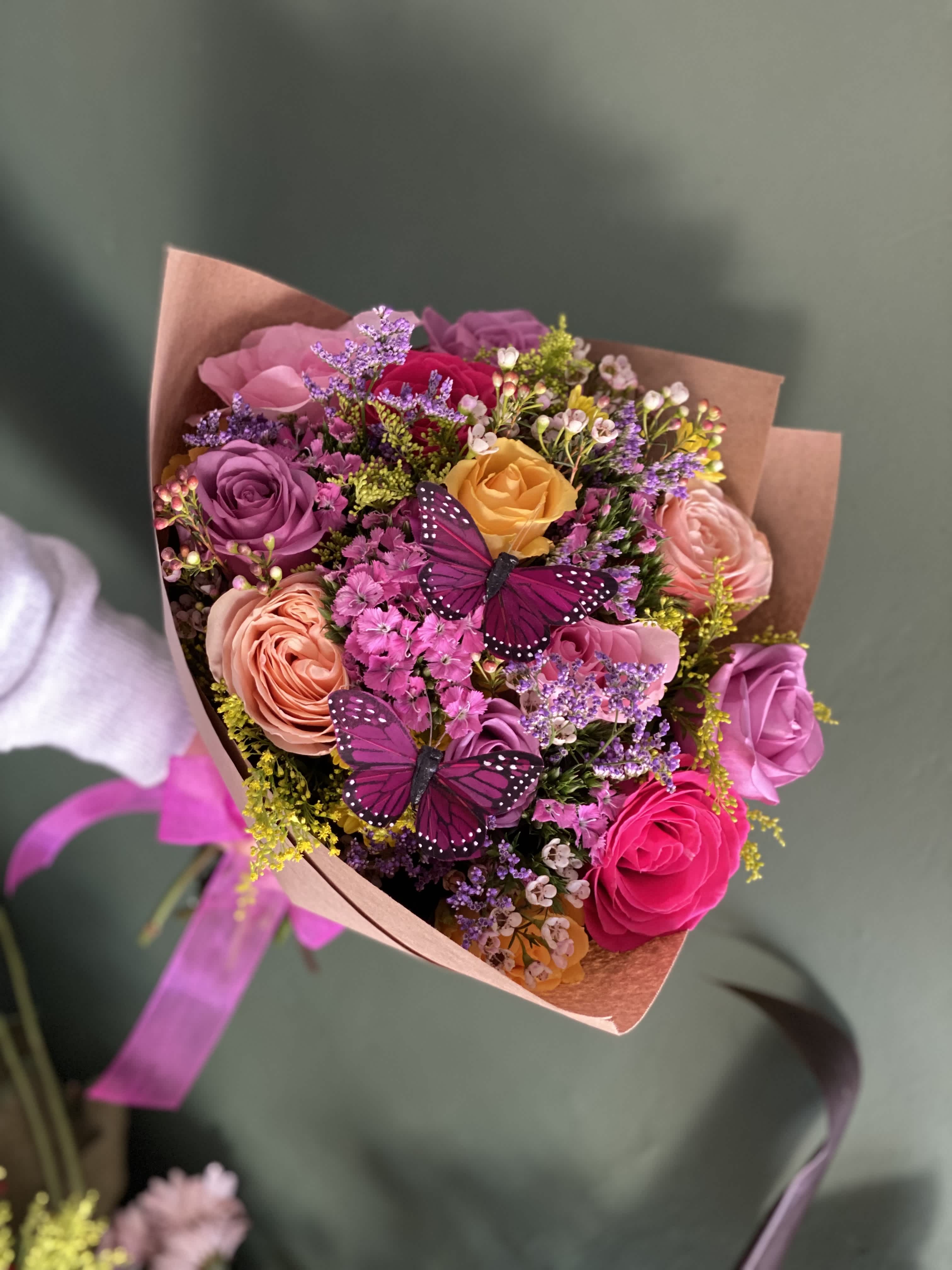 Fairy roses  - For a fairy tale story….. A bouquet of fresh mix color roses and other fillers, topped with butterflies  (Standard size 12 roses, butterflies colors vary)