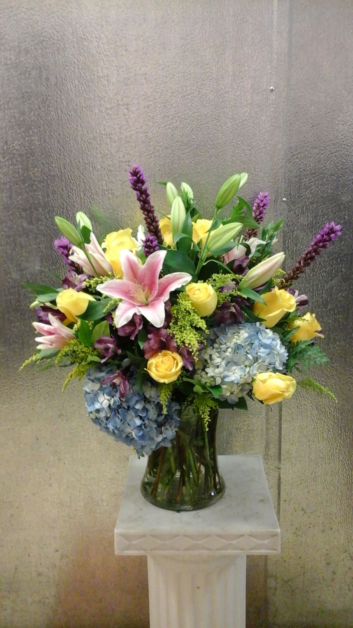 Brilliant blooms - This arrangement with hydrangeas, lilies, roses, and liatris  in a gathering vase