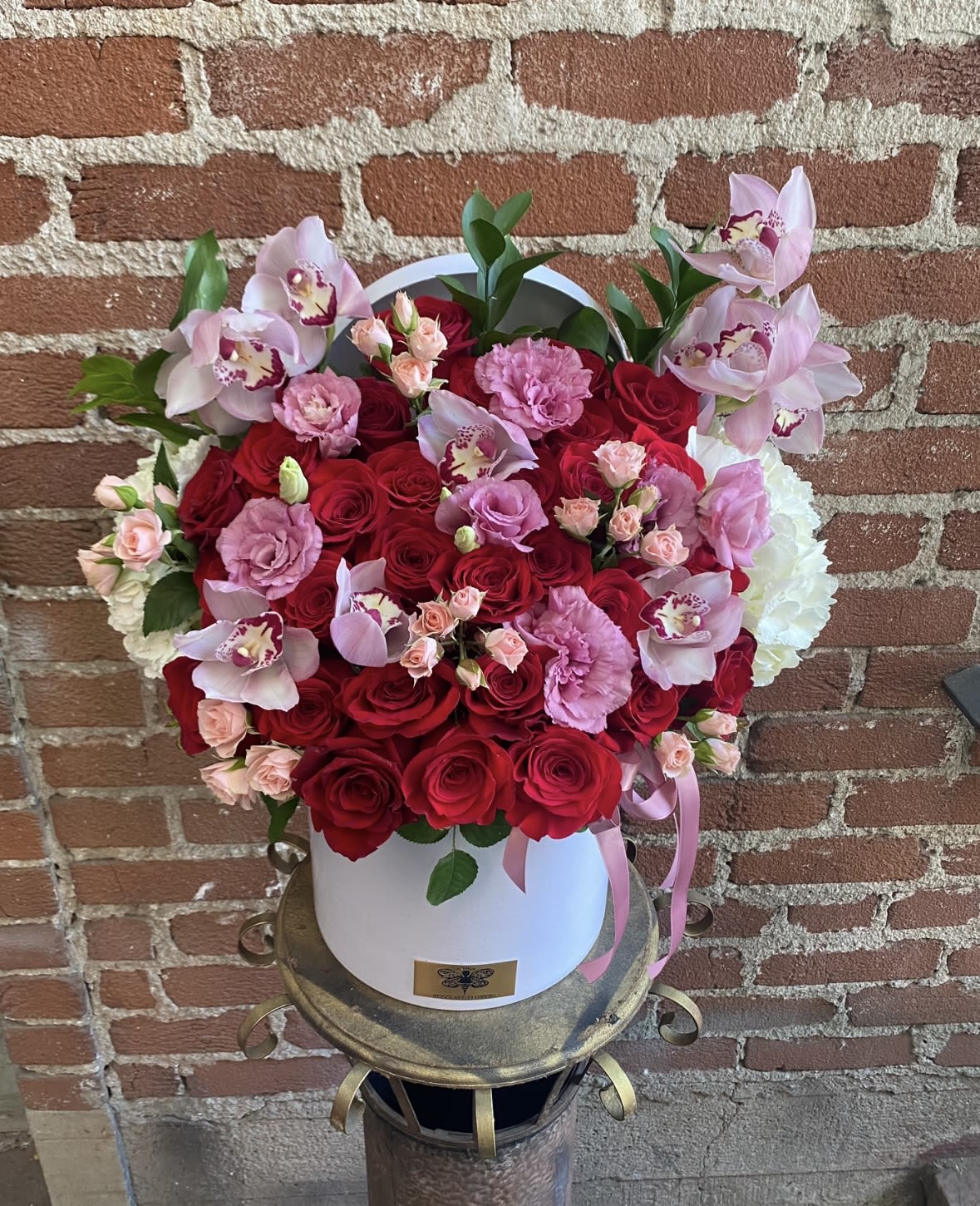 Fairytale -  Santa Clarita Valley Florist - This beautiful arrangement is designed to deliver happiness to a loved ones day. Filled with beautiful Roses, Orchids and other beautiful flowers this box is customized to perfection, this arrangement is a showstopper! If you want to turn heads then this is the arrangement for you!