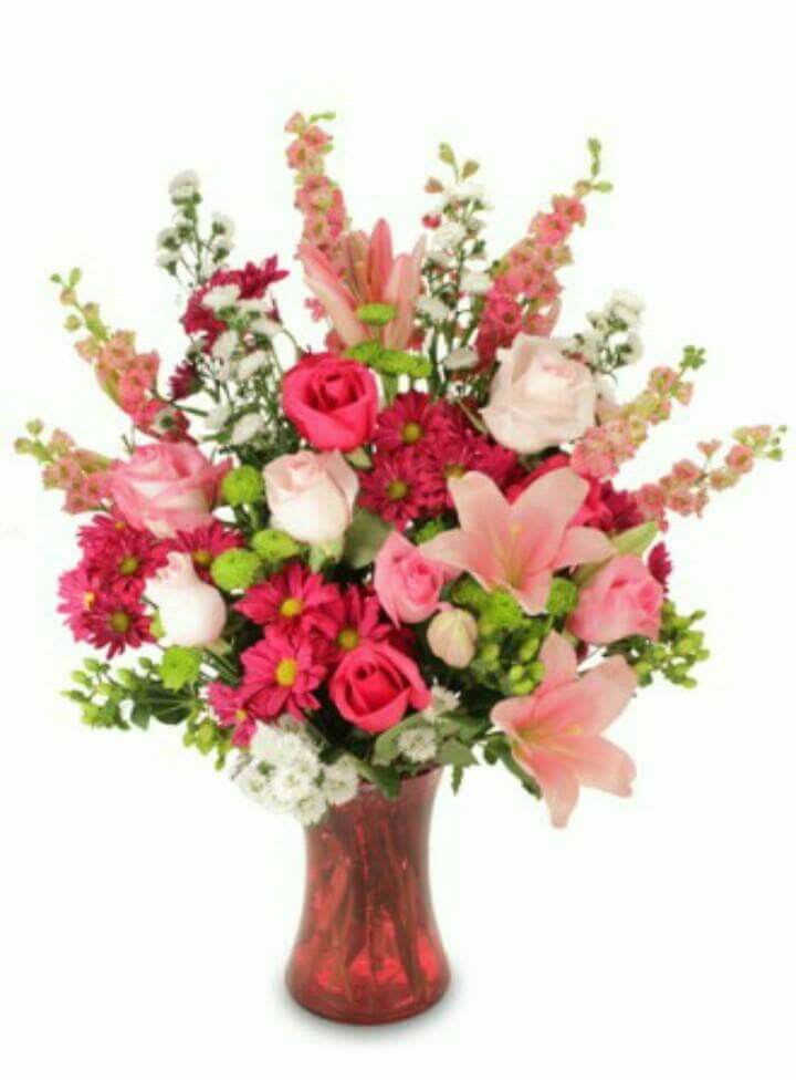 Pink and white mixed bouquet in a red glass vase