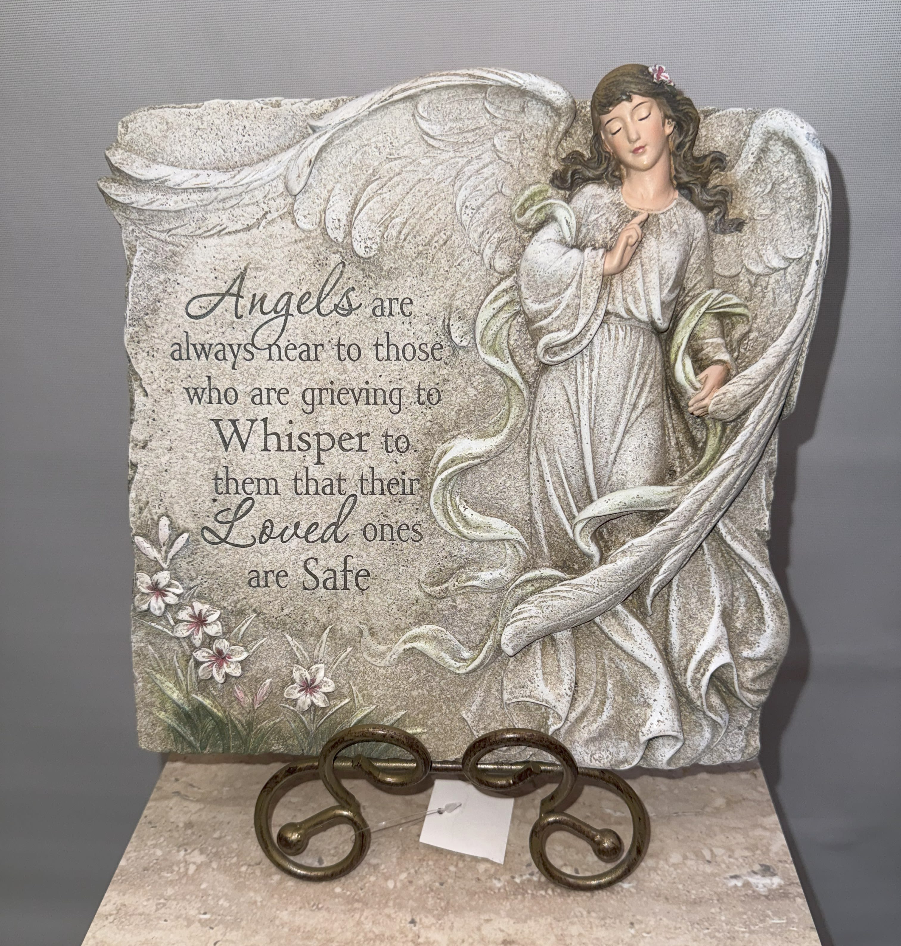 Angel memorial plaque with grieving quote and floral accents