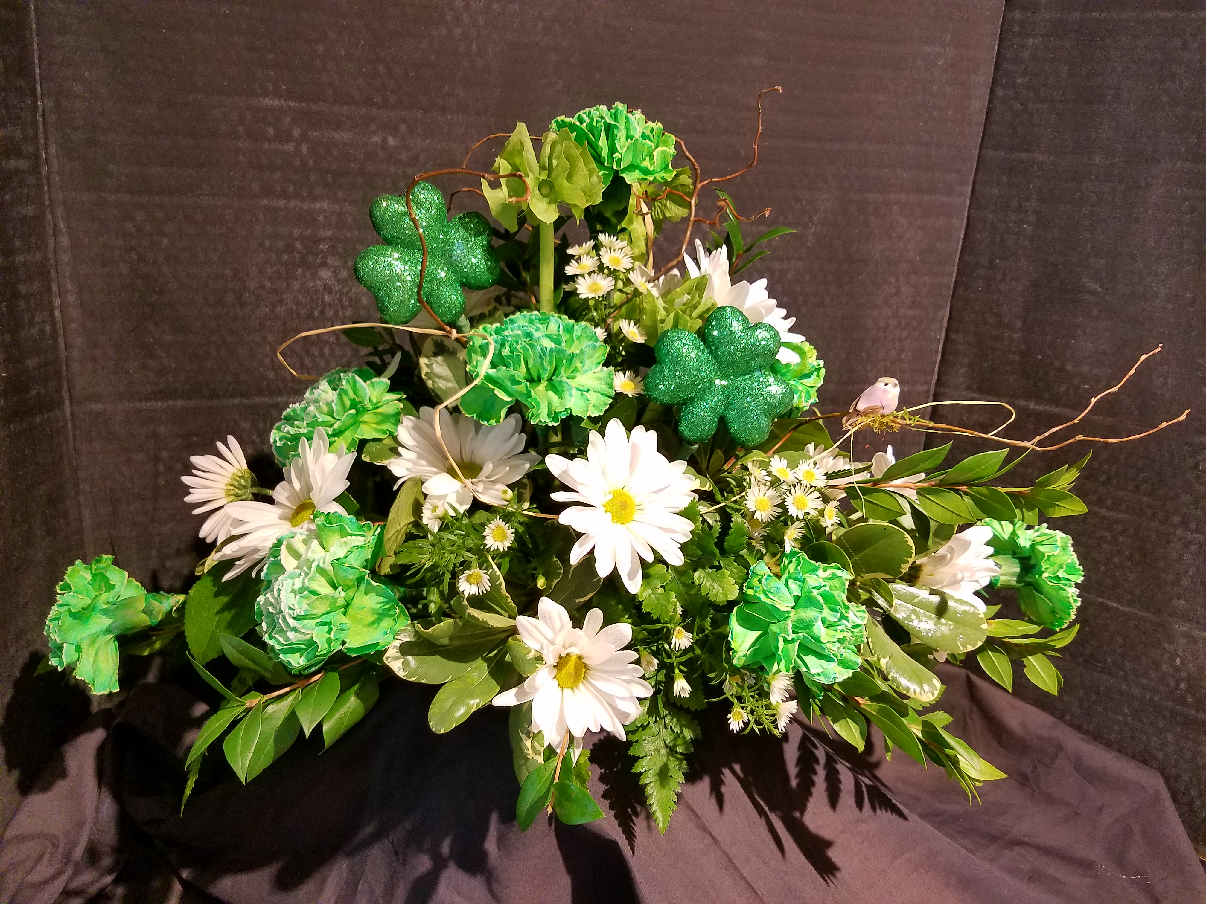Eckert Florist's St. Pat's Centerpiece **LOCAL DELIVERY ONLY - This long and low centerpiece is perfect for any St. Patrick's day celebration or dinner.  **LOCAL DELIVERY ONLY