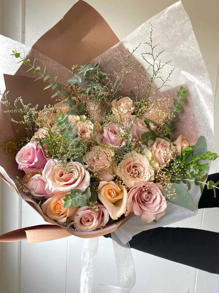 Natural Blush Bouquet - A soft, timeless mix of blush, tan, cream, and peach-toned roses, accented with eucalyptus and seasonal fillers. Effortlessly elegant and perfect for any occasion. 