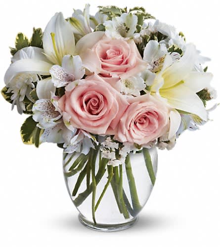 Arrive In Style - This beautiful bouquet will most certainly arrive in style! Ready for the runway as it were. A delightful combination of light colors and lovely flowers it's simply beautiful. Light pink roses white asiatic lilies alstroemeria cushion spray chrysanthemums and statice are delivered in a stylish vase. Style to spare!Approximately 10 1/2" W x 11" H Orientation: One-Sided As Shown : T55-2ADeluxe : T55-2BPremium : T55-2C