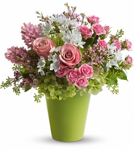 Enchanted Blooms - If fairy tales were made of flowers undoubtedly this is what they'd look like. Charming fresh and fabulous these enchanted blooms are sure to cast a magical spell. Dazzling green hydrangea pink roses spray roses hyacinth and waxflower white narcissus and spring greens are delivered in a bright green cylinder container.Approximately 15" W x 15 1/2" H Orientation: All-Around As Shown : T146-1ADeluxe : T146-1BPremium : T146-1C