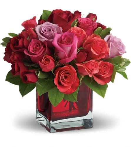 Madly in Love Bouquet with Red Roses by Teleflora - If you're crazy about someone and not afraid to show it this bright jewel-toned arrangement is the perfect way to express your love. Lavender red and hot pink roses along with coral and red spray roses arranged in a red-hot cube vase are an absolutely beautiful way to get your message across.Approximately 11" W x 10" H Orientation: All-Around As Shown : T9-3ADeluxe : T9-3BPremium : T9-3C