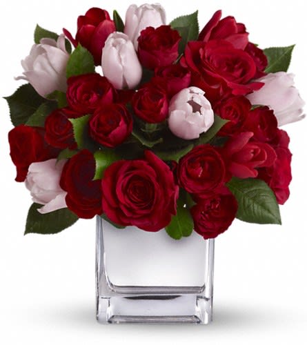 Teleflora's It Had to Be You Bouquet - She's your one and only. Doesn't she deserve an equally singular bouquet? This charming heartfelt arrangement puts a feminine spin on classic red roses by mixing in elegant red and pink tulips. Presented in our modern Mirrored Silver Cube it's a uniquely stunning selection for any day you want to pamper your special one. This unique bouquet mixes large red roses and red spray roses with pink and red tulips. The flowers are delivered in our exclusive Mirrored Silver Cube vase.Approximately 10 1/2" W x 11 1/4" H Orientation: All-Around As Shown : T401-1ADeluxe : T401-1BPremium : T401-1C
