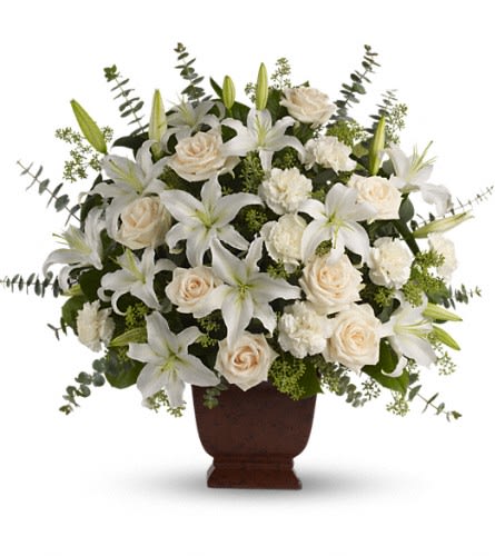 Teleflora's Loving Lilies and Roses Bouquet - A simply beautiful way to show you care. By sending this elegant arrangement to the home of those in mourning you are letting them know they are embraced in your thoughts. And in your heart. Fresh flowers such as cr?me roses white oriental lilies carnations eucalyptus and more are delivered in a lovely Noble Heritage urn.Approximately 27" W x 25" H Orientation: One-Sided As Shown : T216-1A