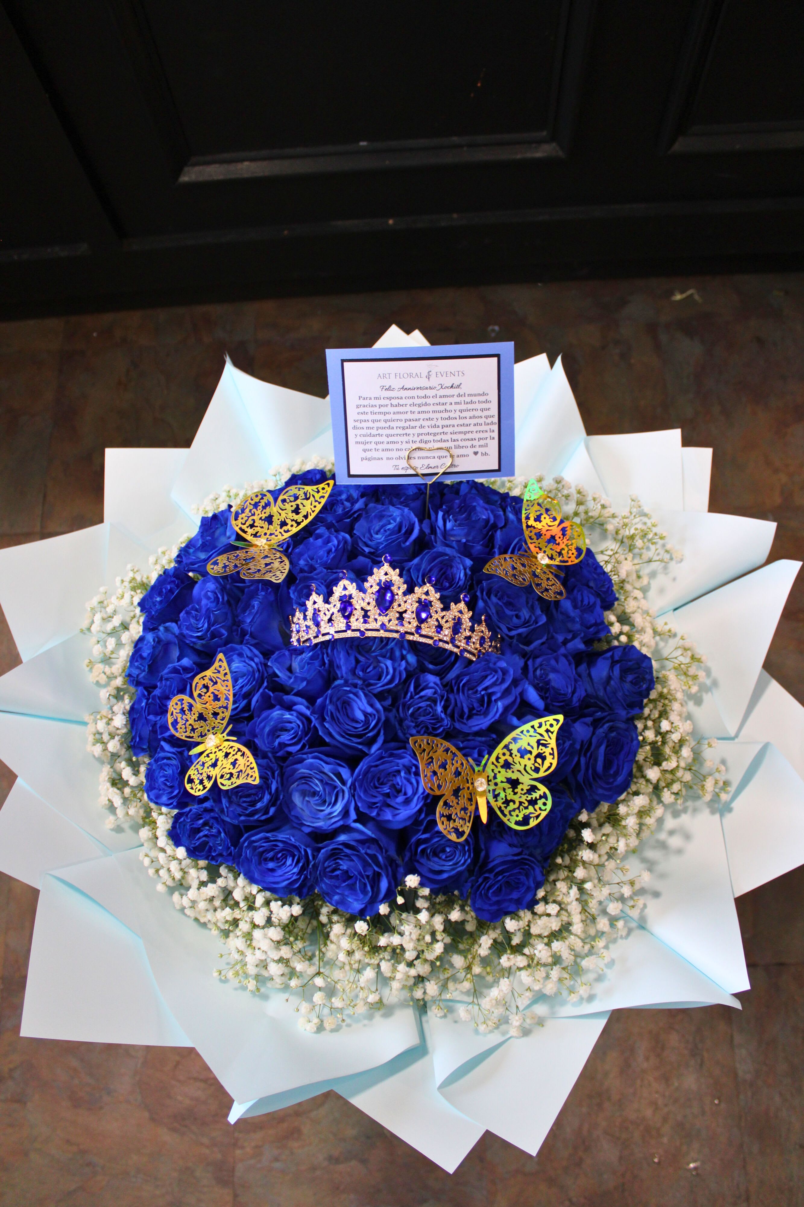Princess Treatment - Blue - 50 ct Blue Roses. Babies Breath, matching blue tiara, Gold butterflies.  Baby Blue wrap   *NO VASE*