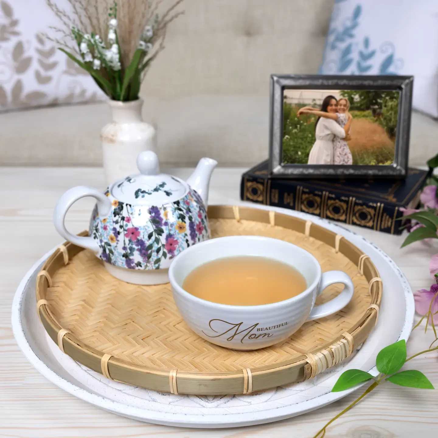 Mom - Tea For One (14.5 oz Teapot &amp; 10 oz Cup) -  Crafted from high-quality stoneware, this elegant 2-piece tea-for-one set includes a 10 oz teacup and a 14.5 oz teapot. The teapot sits snugly on top of the teacup, with a secure, fitted lid that prevents spills and keeps the tea warm. The set’s durability ensures it withstands daily use, making it ideal for moms who enjoy a peaceful moment with their favorite tea blend. The design boasts a beautiful full-wrap floral motif inspired by classic garden blooms, wrapping around both the teapot and teacup (excluding the handle and interior). The cup features a golden "Beautiful Mom" decal in a delicate, cursive font, giving a touch of elegance to the set Tea infuser available for an additional purchase