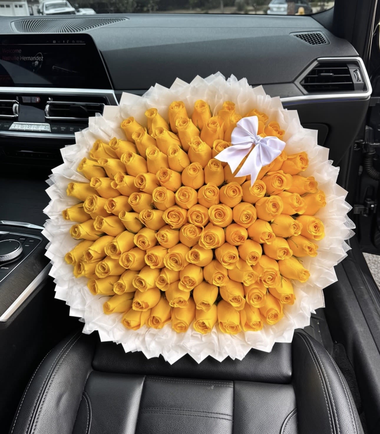 My Sunshine Ramo Buchon  - Bright, bold, and unforgettable — this stunning bouquet features a large arrangement of vibrant yellow roses beautifully packed into a full, rounded design for a luxurious look. Each fresh rose is carefully placed to create a lush, eye-catching display that radiates happiness and warmth. The bouquet is elegantly wrapped in soft white ruffled wrapping and finished with a delicate white bow, giving it a modern and sophisticated presentation.  Yellow roses symbolize friendship, joy, and celebration, making this bouquet the perfect gift for birthdays, congratulations, thank-you gifts, or simply to brighten someone’s day