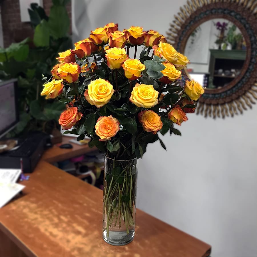 Summer Sun  - Premium two-tone yellow roses are arranged in a cylinder glass vase. 