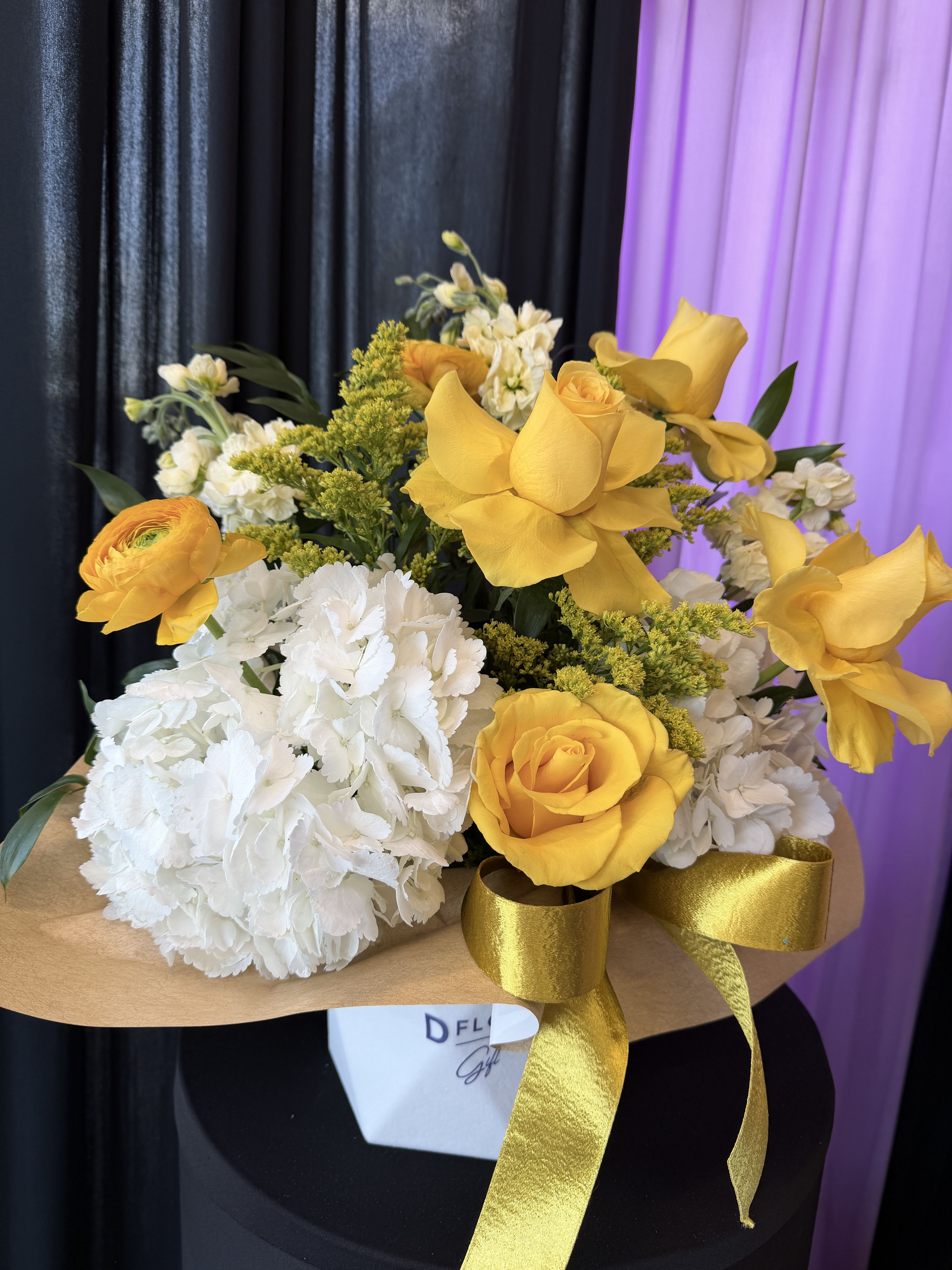Golden Sunshine Bouquet - This arrangement has a bright, elegant yellow and white look with a gold ribbon, which gives it a luxury, sunshine, and joyful feeling. Here are some beautiful name ideas you could use for your shop: