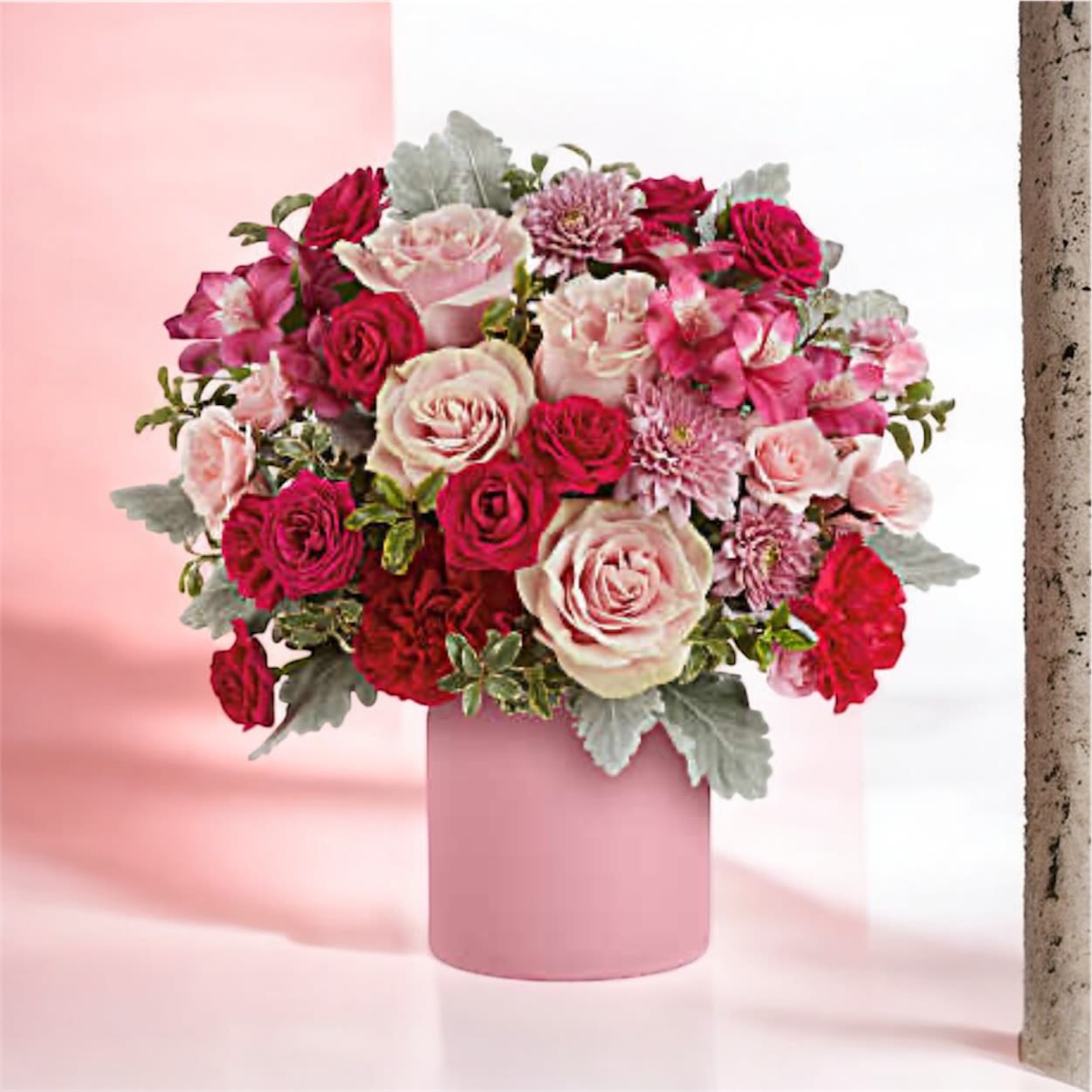  Sweetest Mauve Bouquet - Brighten their day with Teleflora's Sweetest Mauve Bouquet, a stunning mix of pink and red blooms presented in a frosted pink jar for a stylish and uplifting display. Teleflora's Sweetest Mauve Bouquet includes light pink roses, hot pink spray roses, dark pink alstroemeria, hot pink carnations, miniature light pink carnations, and pink cushion spray chrysanthemums, accented with dusty miller and pitta negra. Delivered in a pink frosted Savannah jar for a modern, elegant look.