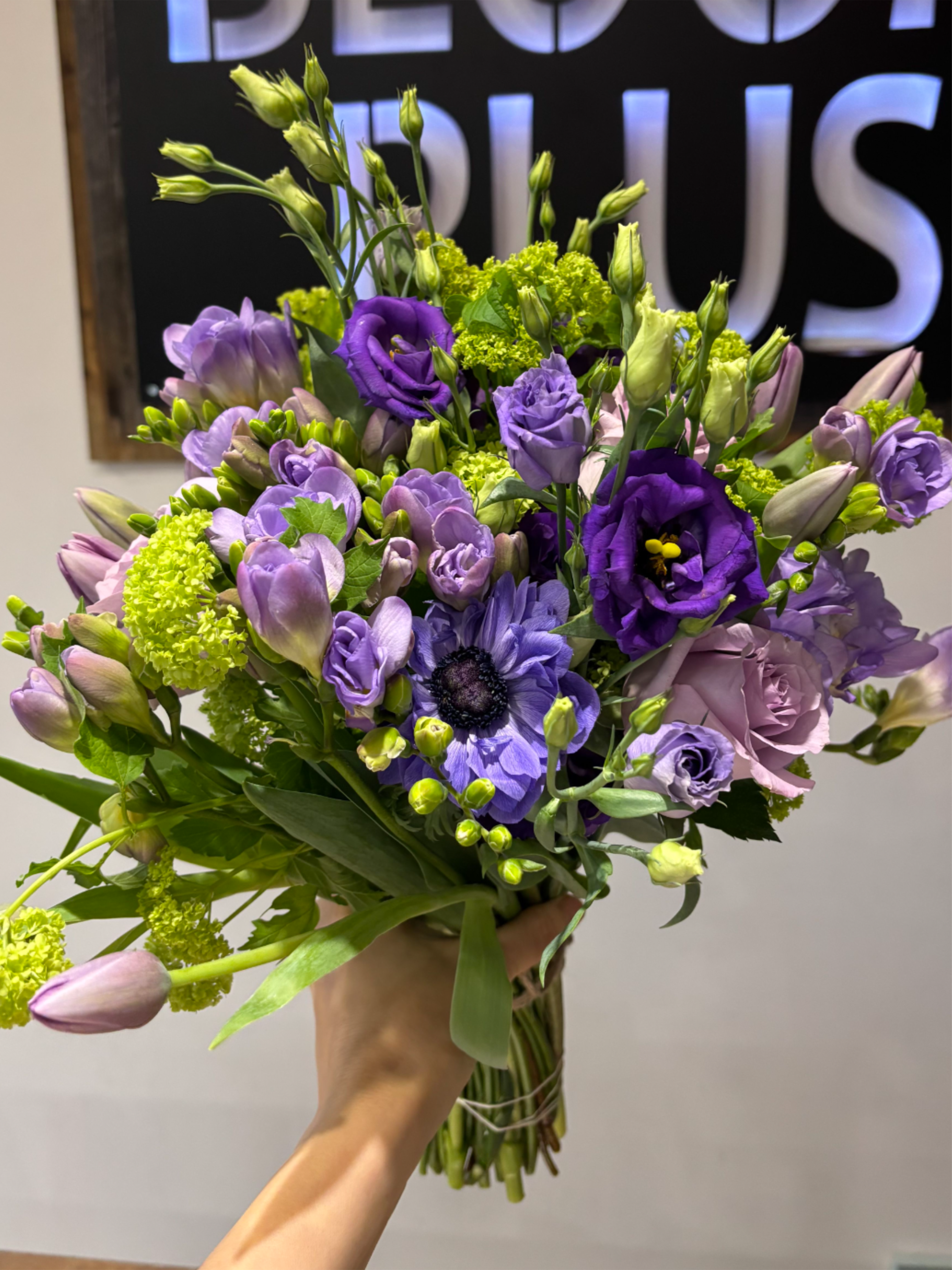 Purple-licious    - Bold purple bouquet featuring anemone, tulips and freesia. 