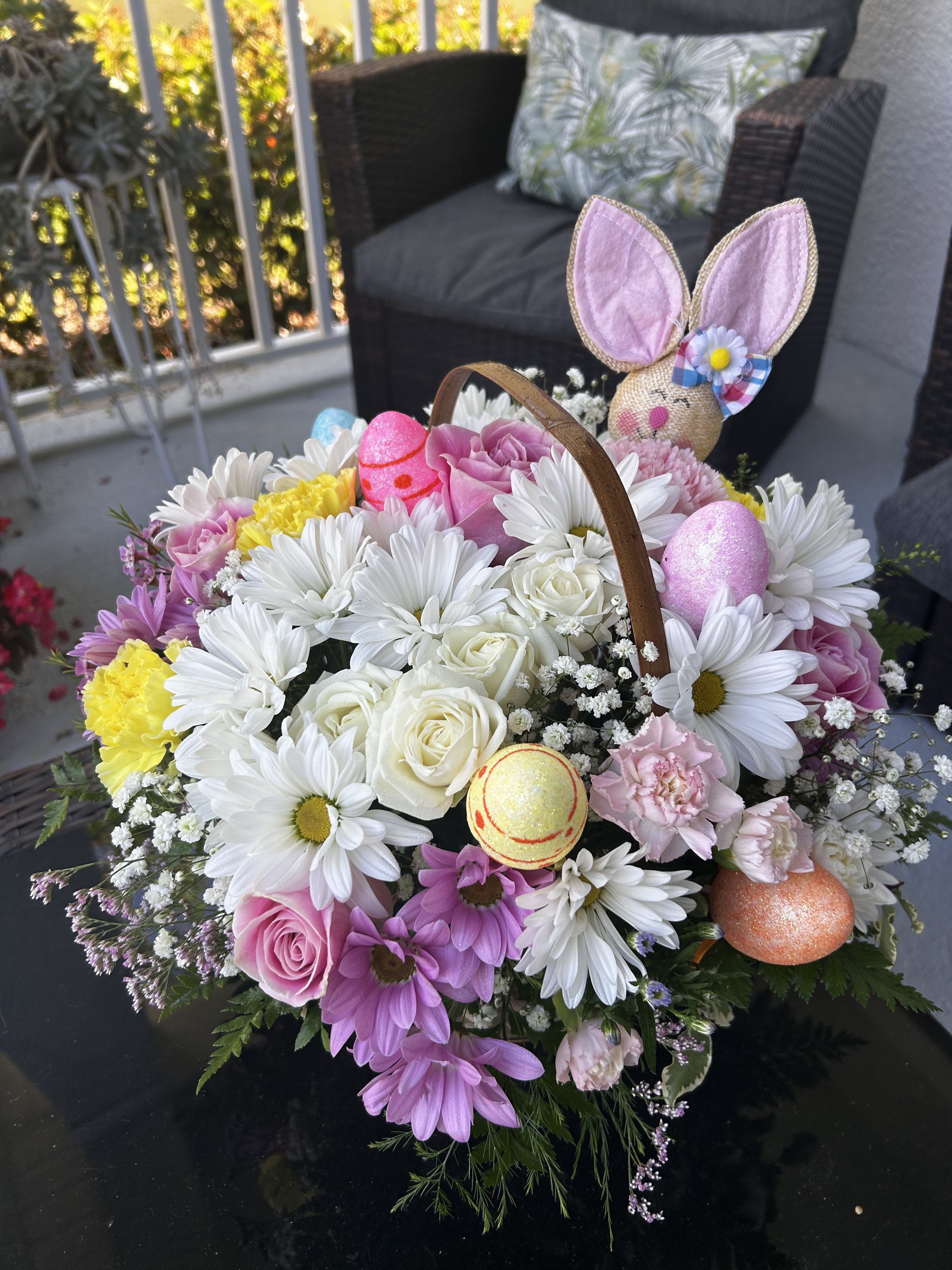 Easter Egg basket - A delightful way to deliver Easter wishes. We’ve gathered fresh-picked pastel blooms and colorful eggs inside a charming handled basket. It’s a gift of instant happiness for family and friends, both near and far.
