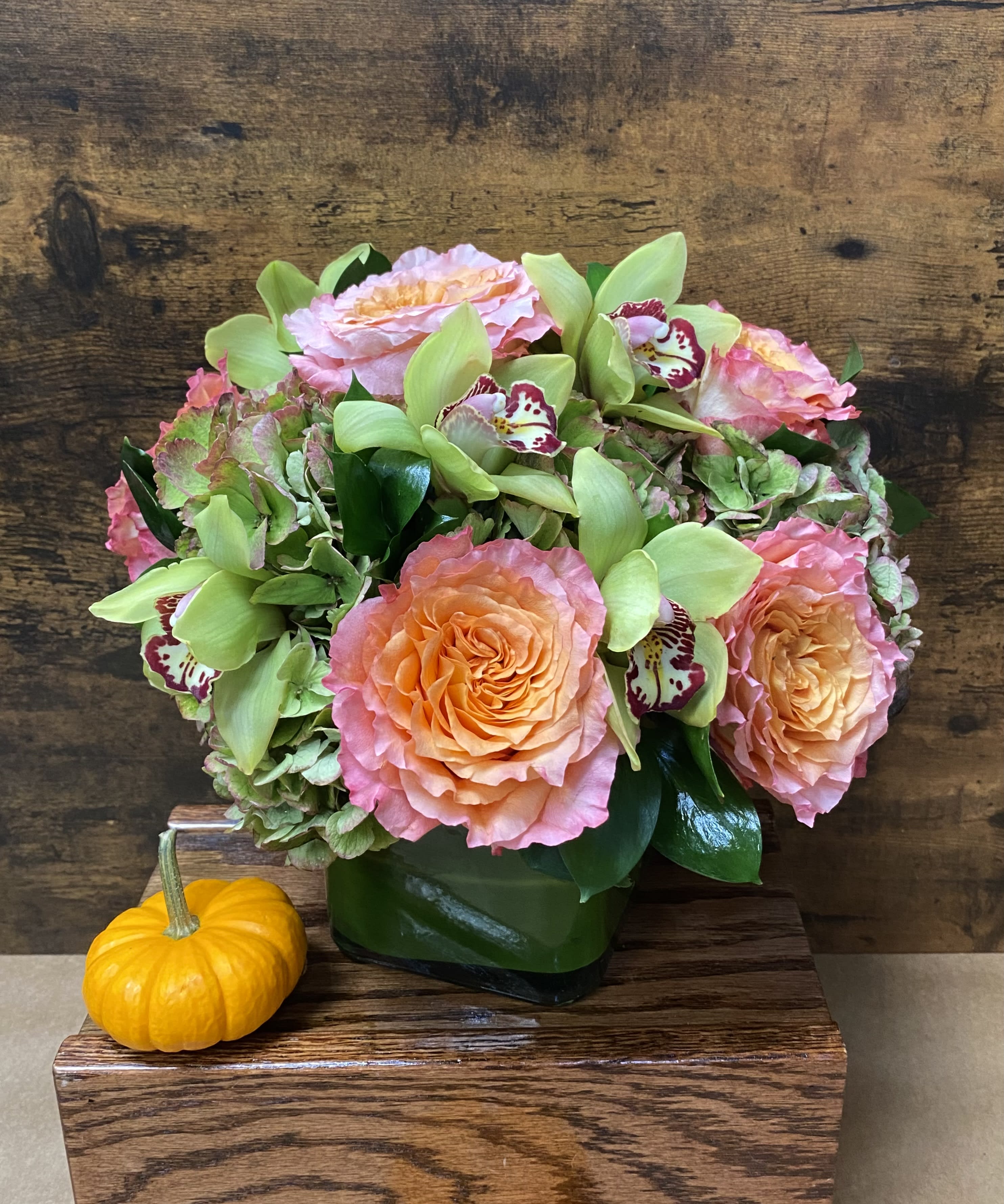 Kymbe  - Rustic centerpieces of Dutch hydrangeas, cymbidium orchids, &amp; roses