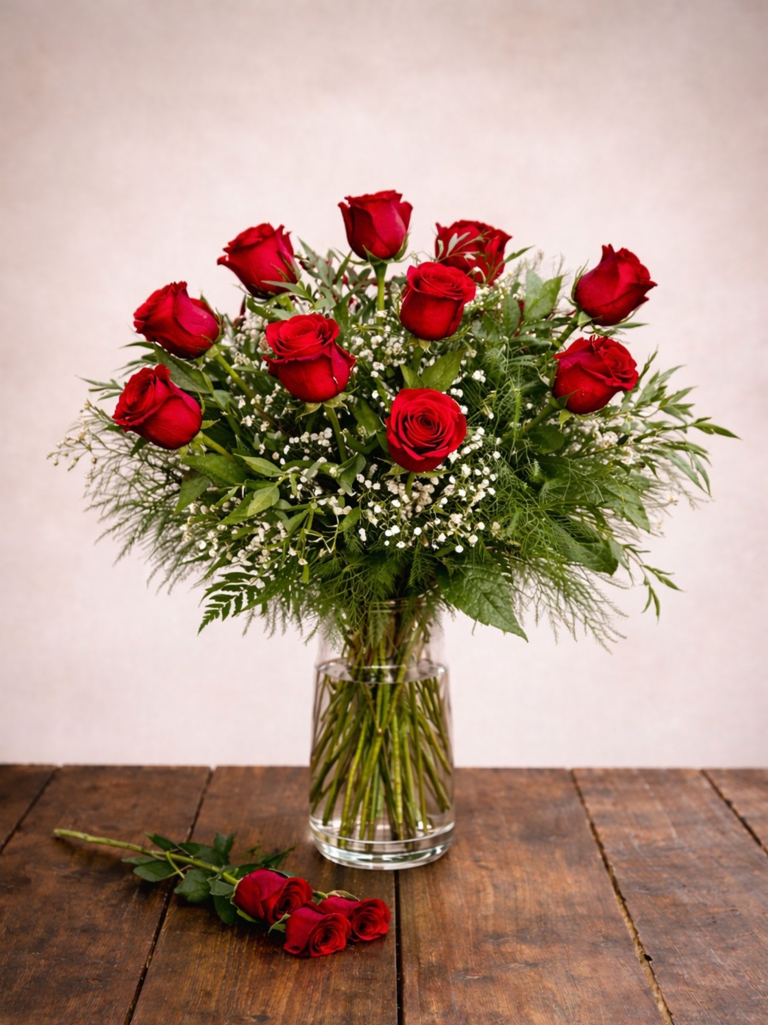 One Dozen Red Roses  - A dozen stunning red roses. The best gesture of love! Everyone deserves these love stems for any special day!1 Dozen beautiful Red Roses professionally designed with soft fillers and lush greens for a perfect presentation!   A unique arrangement hand created by our experienced designers. Please note that every design is custom made and substitution to container and flower types may happen from time to time. Design aspects will always stay the same, but if needed, we will substitute with flowers of equal or greater value to offer you a great floral shopping experience! Our flowers are 100% guaranteed. Please call us with any questions or concerns.