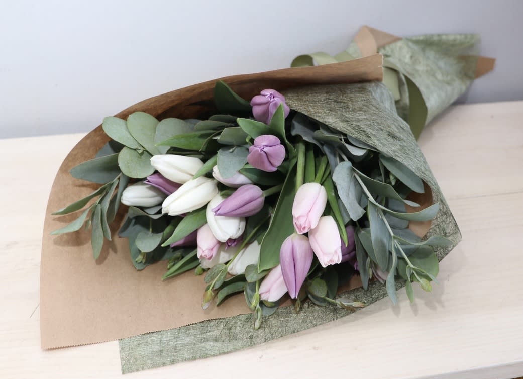 Tulip Bunch - Glendale Florist - Two bunches of premium tulips wrapped up in craft paper. Available almost all year long and in any color. Call or indicate colors in special instruction box at checkout. Typically made with blush, lavender and white tulips.  Upgrades have 3 bunches and 4 bunches. 