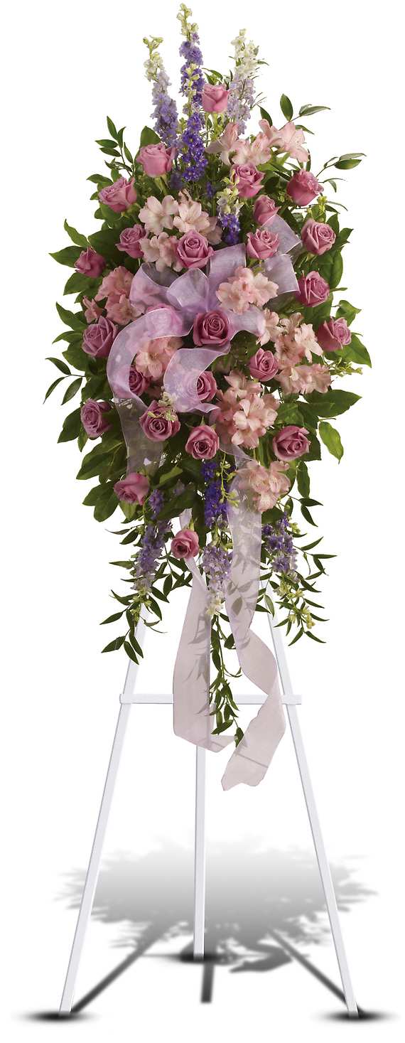 FINEST FAREWELL SPRAY - This abundant spray of soft, feminine spring colors feels as calming as a walk in the countryside. Sheer organza ribbon is threaded through lavender, purple and pink blooms that are accented by trailing greens.  