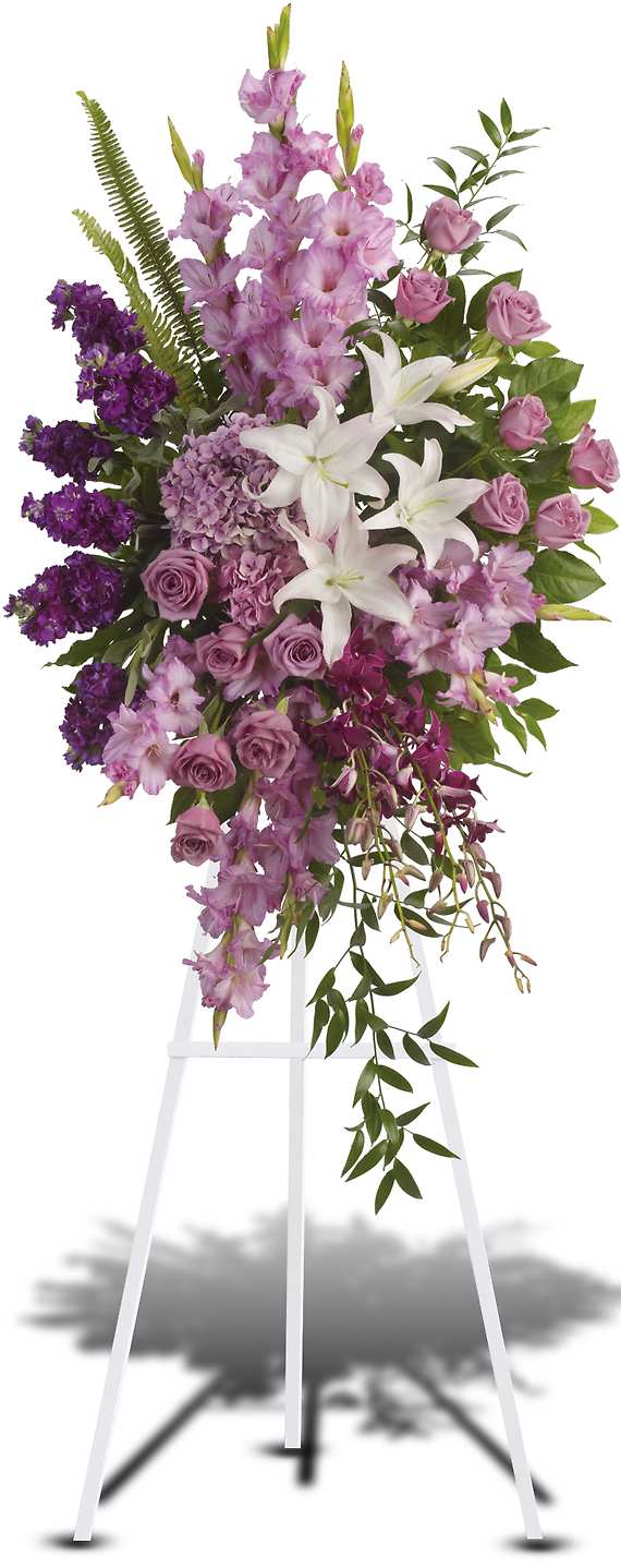 SACRED GARDEN SPRAY - Blessed, peaceful rest is expressed in this cascading purple spray accented with white lilies. Such graceful grandeur would honor a memorial service.  