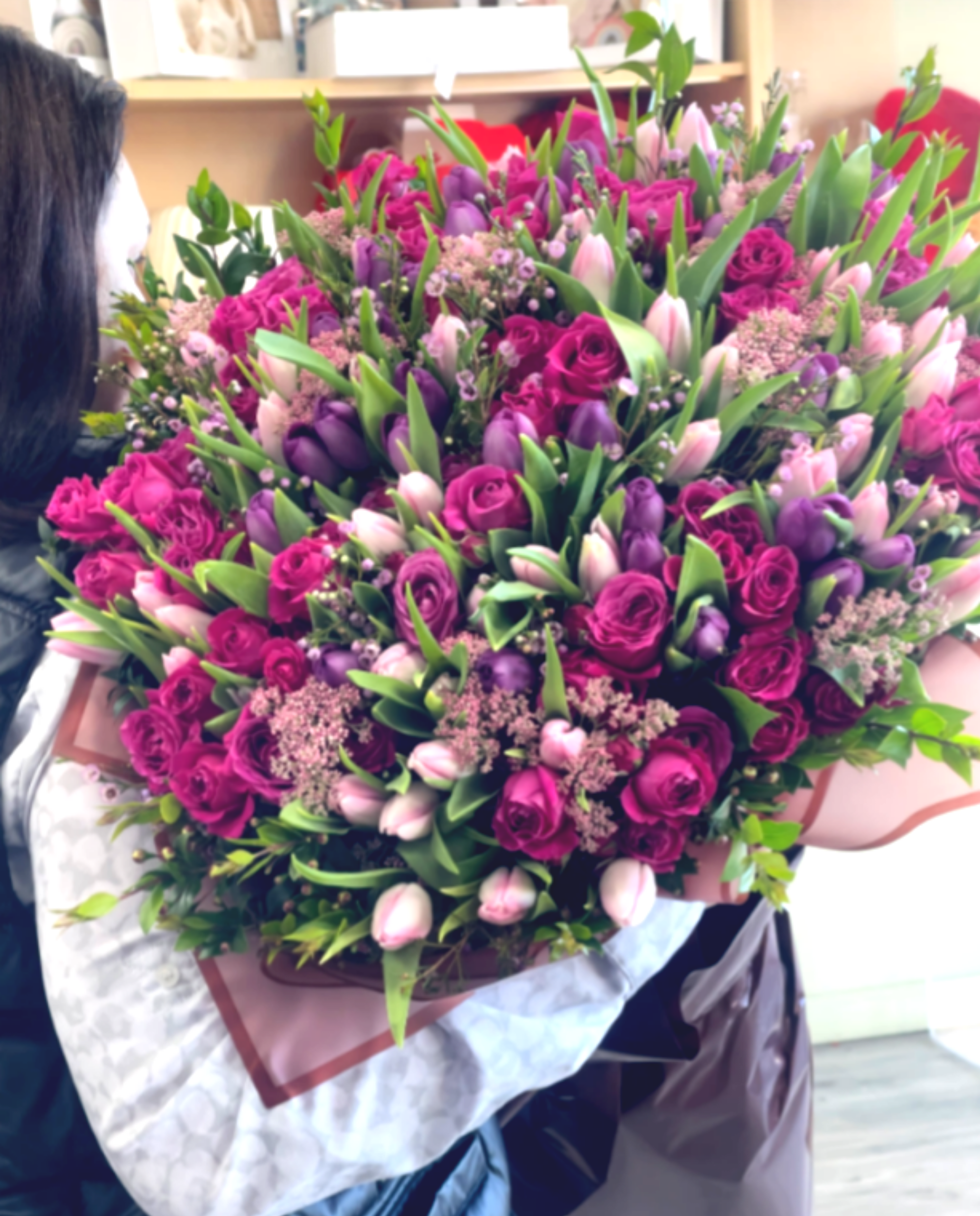 Grand Luxury Pink Rose &amp; Tulip Bouquet - A breathtaking grand luxury bouquet filled with vibrant pink roses, lavender tulips, blush tulips, and delicate seasonal filler flowers surrounded by lush greenery. Designed in an abundant garden style, this arrangement creates a full, romantic display with rich color and texture.  Perfect for anniversaries, birthdays, romantic surprises, celebrations, or luxury gifting, this oversized bouquet makes a stunning statement and fills any room with elegance and beauty. Carefully arranged by florists and wrapped in elegant paper, it delivers a premium floral experience.  Some florals are seasonal, if a particular flower will not be available due to season, we will substitute for similar flower, composition, color pallet and value of the arrangements as closely as possible. All effort to create a floral arrangement as close to the photo shown, the actual arrangement may vary slightly in its appearance from the photo shown. If you have any questions about your order, we welcome you to call us in or email     