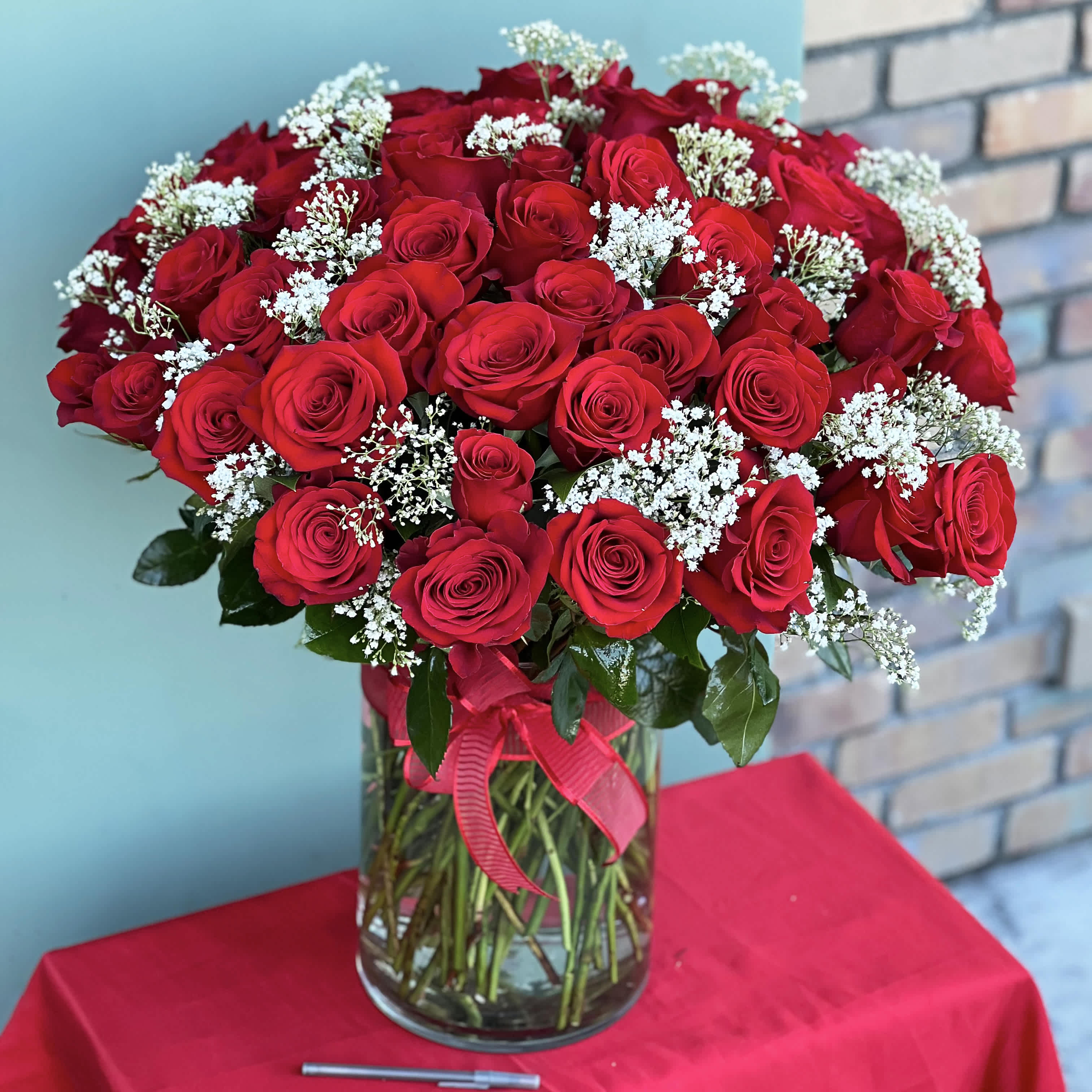 5 Dozen Roses In Vase - 5 Dozen long stem Ecuadorian Roses in a glass vase with greens and fillers 