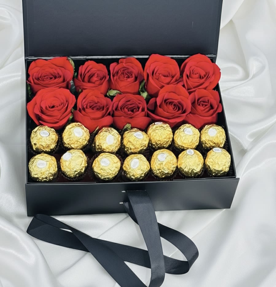 Luxury Rose &amp; Chocolate Gift Box - Indulge in the perfect balance of elegance and sweetness with our Luxury Rose &amp; Chocolate Gift Box. This beautifully designed arrangement features fresh premium roses carefully arranged inside a sleek gift box, paired with delicious gourmet chocolates for an unforgettable surprise.  Each piece is handcrafted with attention to detail, creating a refined and romantic presentation ideal for birthdays, anniversaries, Valentine’s Day, or any special moment that deserves something extraordinary.  Available in white or black box options. Rose colors may vary depending on availability while maintaining the same elegant style and design.  A timeless gift designed to impress. 