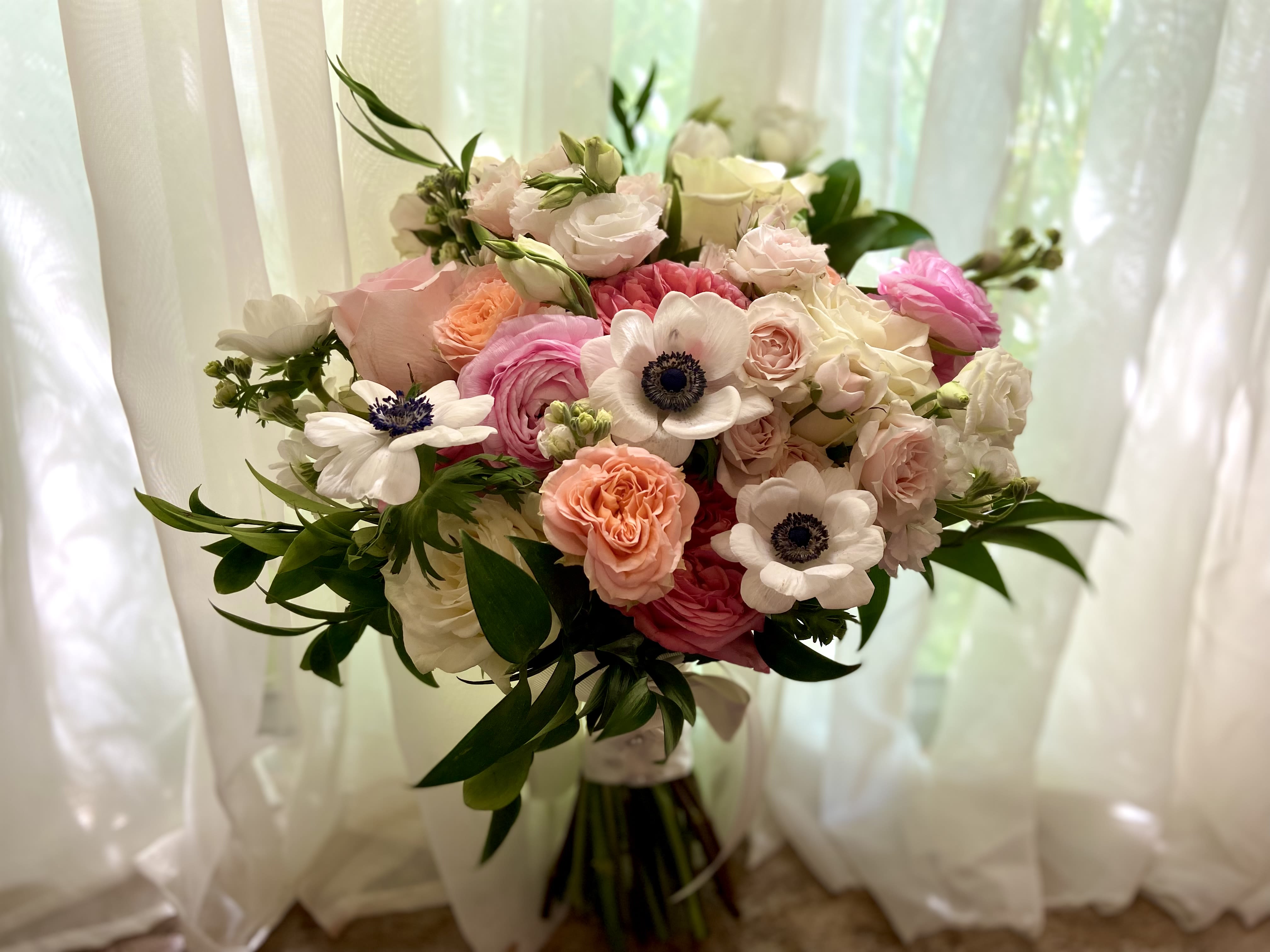 Bridal Beauty Bouquet Fresh flowers - order in advance - Call 917-968-6088 to get a custom order of this bouquet or something similar for your wedding. Free consultation.   Beautiful bridal bouquet of fresh flowers in whites, pinks, peaches and green.  Lovely combination of anemones, roses, ranunculus, stock, lisianthus, stock and more.   