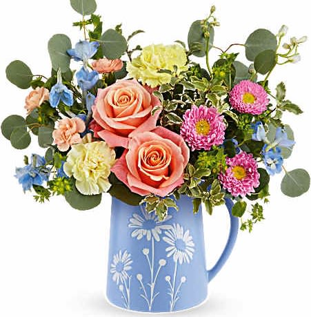 Teleflora's Daisy Dreams Bouquet - Brimming with fresh-picked charm, Teleflora's Daisy Dreams Bouquet delights with peach roses, yellow carnations, and cheerful blooms arranged in a food-safe blue pitcher adorned with a sweet white daisy design.