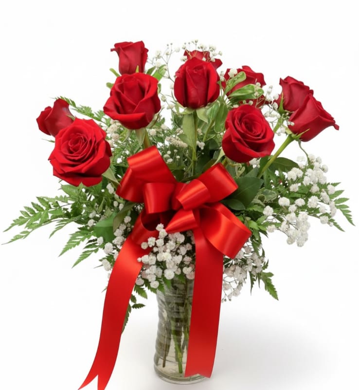 Classic Dozen Red Roses - Timeless and romantic, Classic Dozen Red Roses is the ultimate symbol of love and admiration. This elegant arrangement features twelve premium long-stem red roses beautifully arranged with delicate baby’s breath and fresh greenery for a soft, classic look. Finished with a bold red satin bow and presented in a clear glass vase, this bouquet is both traditional and stunning.