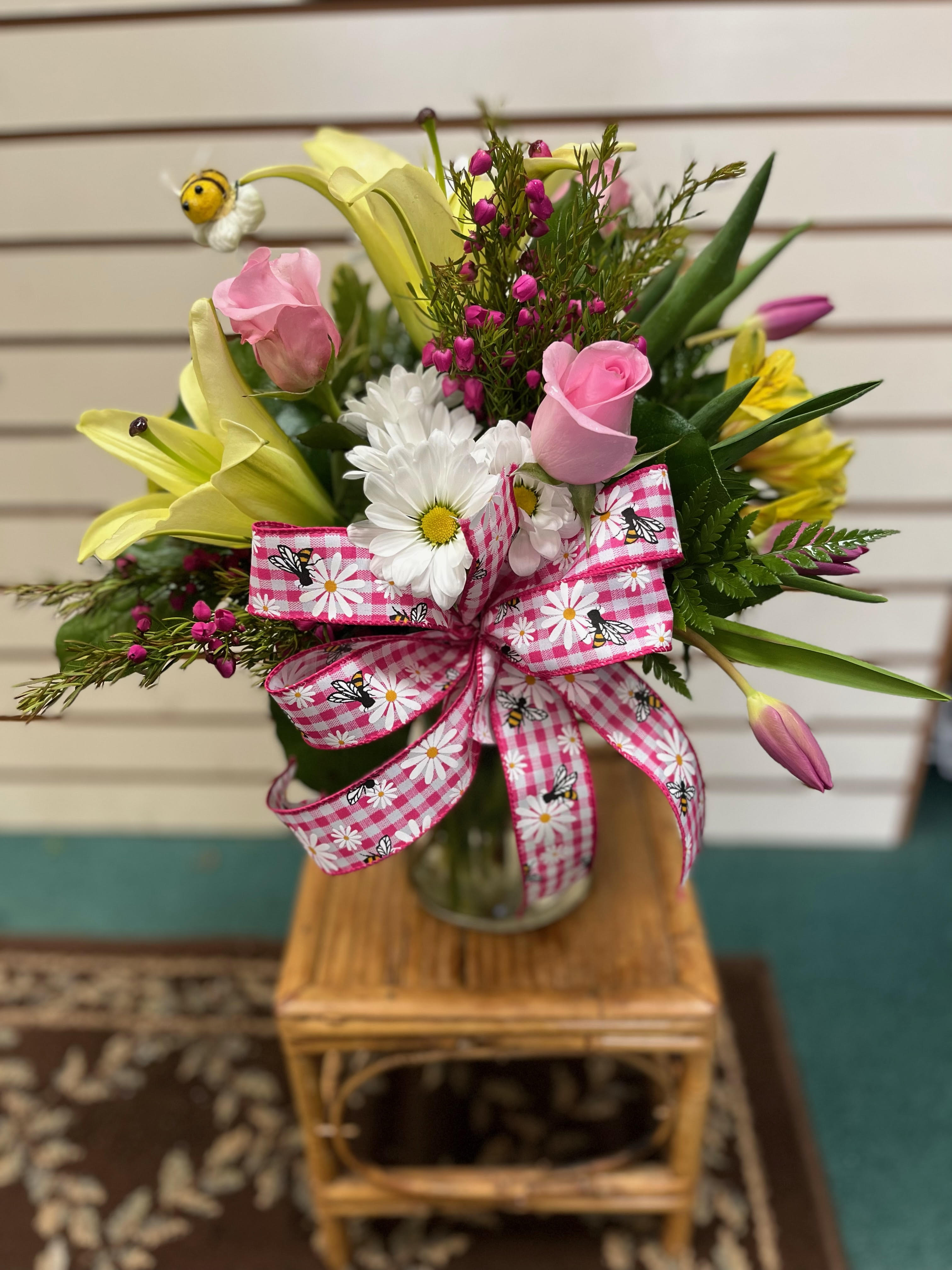 BEE Happy - Pink white and yellow floral arrangement cute as can BEE! Accented with a mini bumble bee and a pink bow with bees!