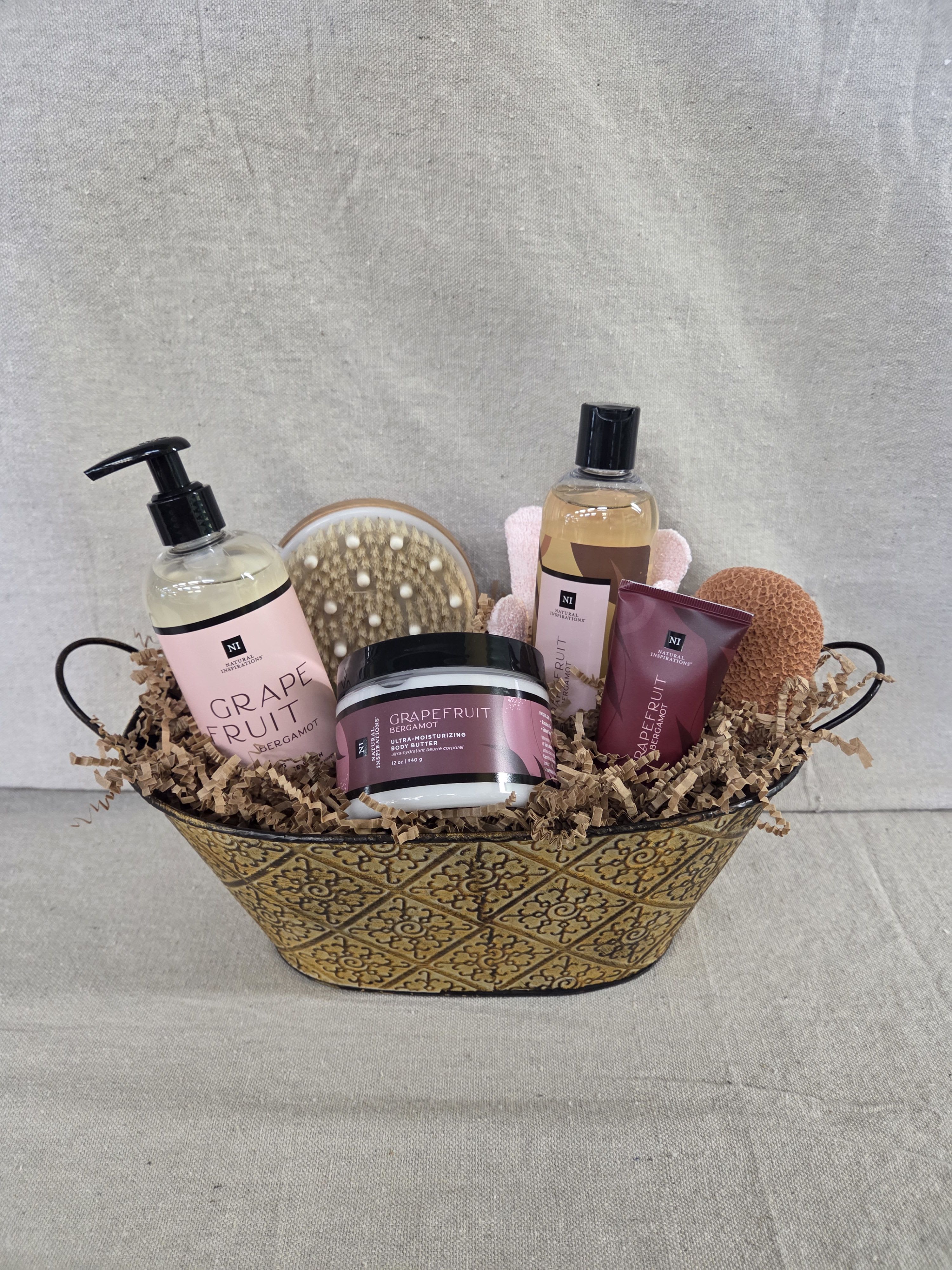 Spa Basket - Grapefruit - Our spa basket includes a variety of bath and body products in soothing scents, with additional bath items packaged in a decorative container.